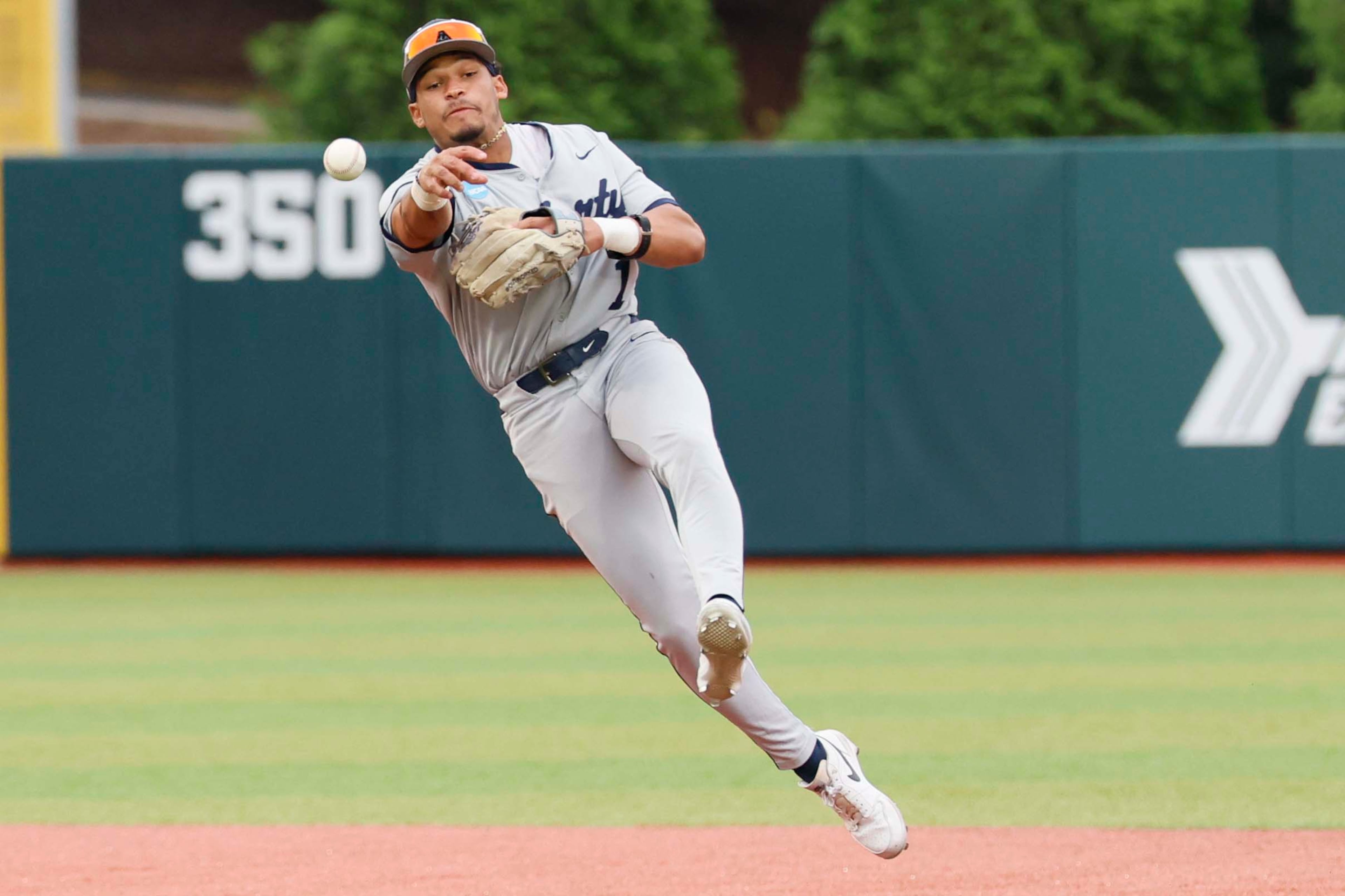 Liberty Flames infielder Tanner Marsh (1) throws the ball for an out during the sixth inning of their NCAA Regional final game at Foley Field against the University of Georgia on Sunday, May 31, 2026, in Athens. (Miguel Martinez/AJC)