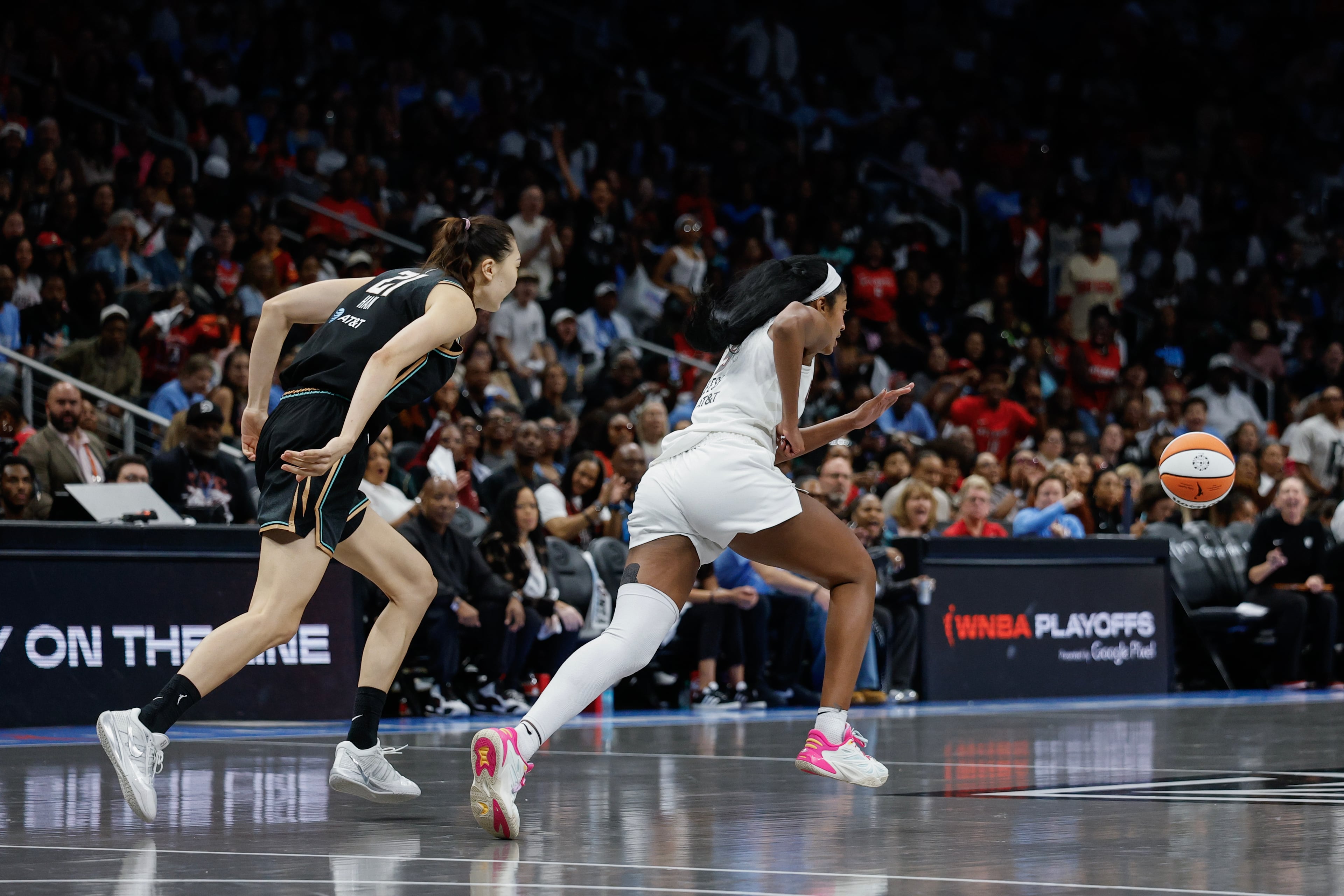 Atlanta Dream forward Angel Reese (5) makes a steal against New York Liberty center Han Xu (21) during the second half of a WNBA semifinal playoff game 1 between the Atlanta Dream and the New York Liberty, Sunday, Oct. 4, 2026, in Atlanta. (Erik S. Lesser for the AJC)
