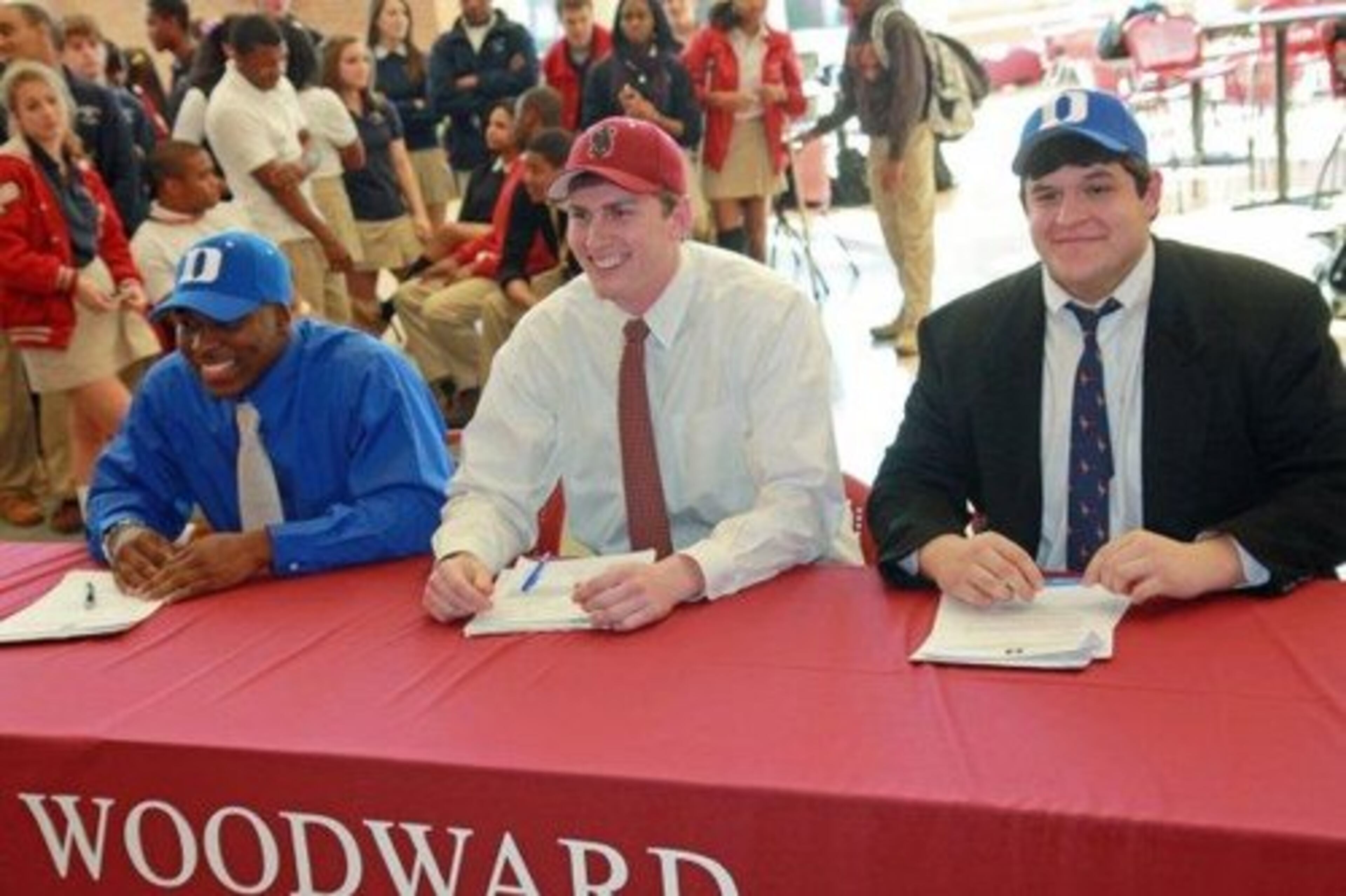 Three student athletes from Woodward Academy signed letters of intent Wednesday. Juwan Thompson(left)and Will Bryant (right) are headed to Duke. Henry Anderson (middle)is going to Stanford.