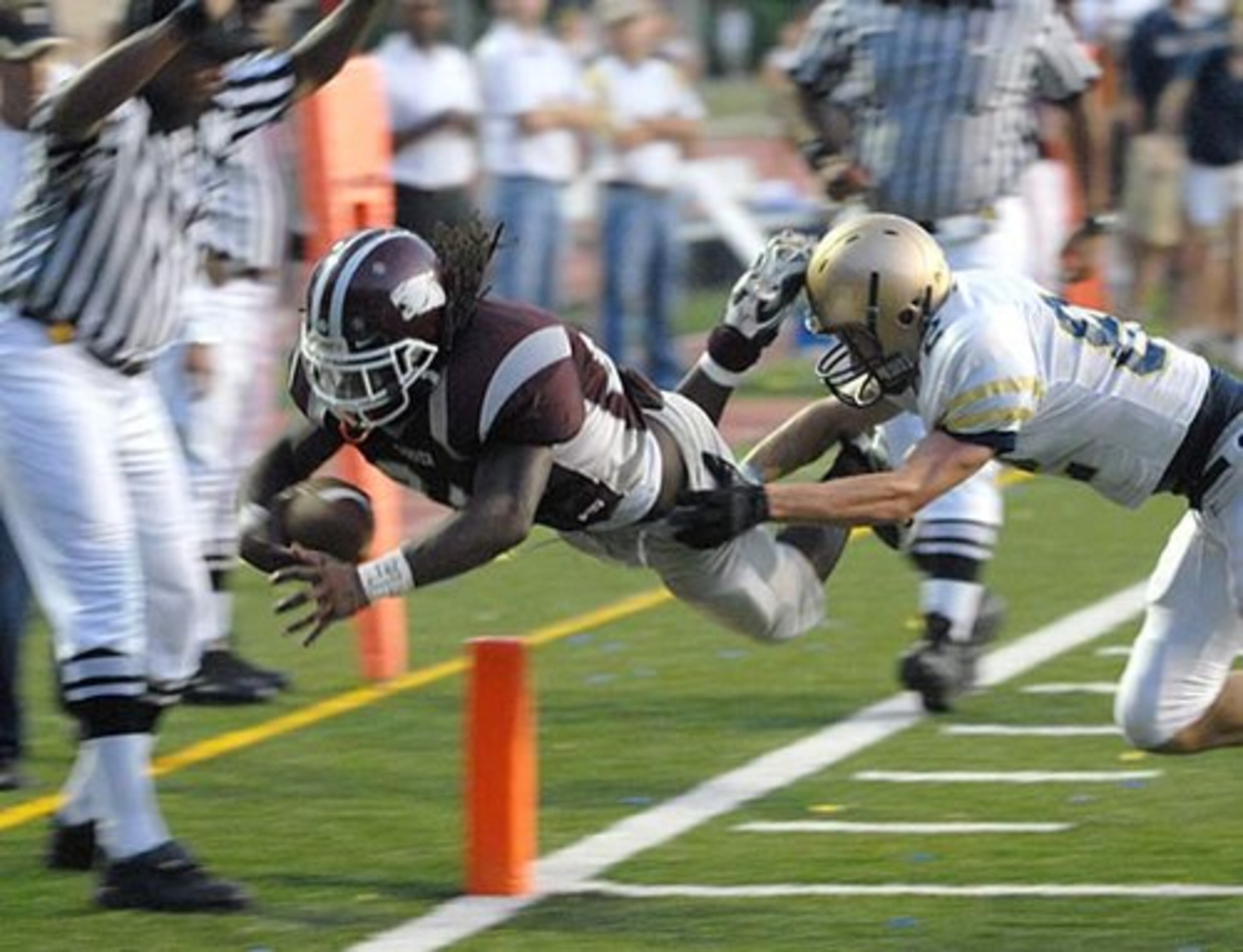 Carver-Atlanta's Demond Dennis (left, with ball) rushed for 1,600 yards and 13 touchdowns last season for the Panthers' quarterfinalist team. Considering Alabama, Alabama-Birmingham, Auburn, East Carolina, Illinois, Louisville, Miami-Ohio and Western Kentucky.