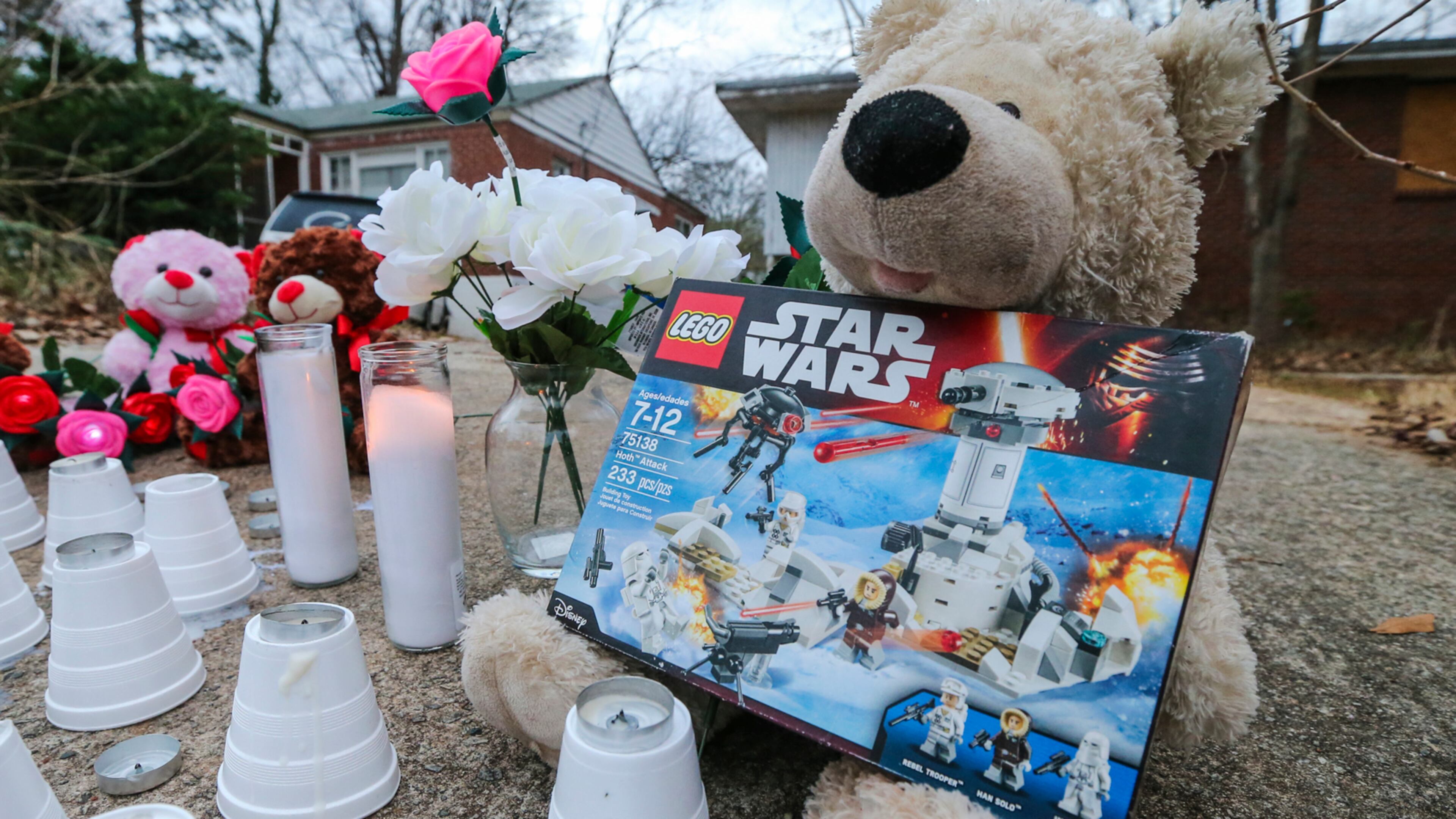A memorial was placed overnight into Wednesday morning, Jan. 18, 2017 on Jasper Street near where a boy was killed and a girl was injured early Tuesday in a pit bull attack on their way to school, Atlanta policeÊsaid.