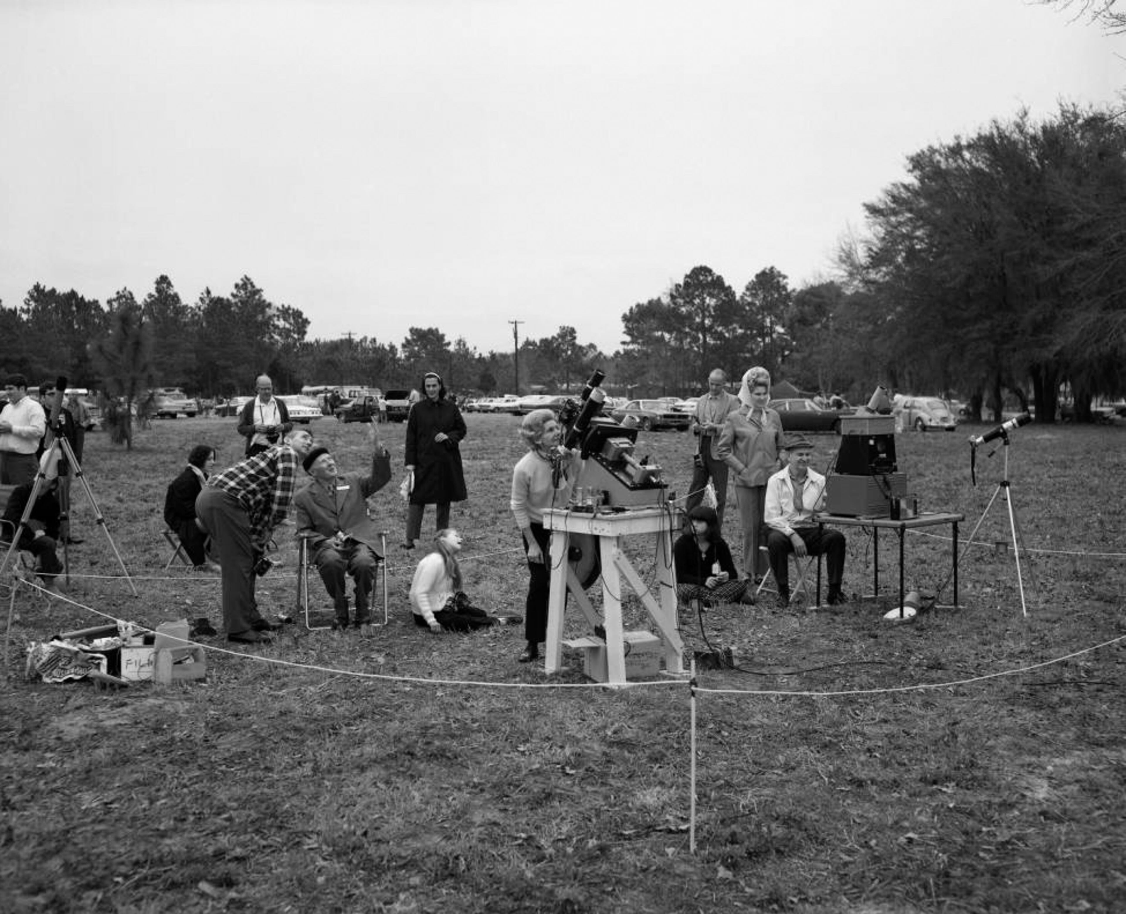 Group of astronomers gather to watch the solar eclipse on a cloudy day, March 7, 1970.