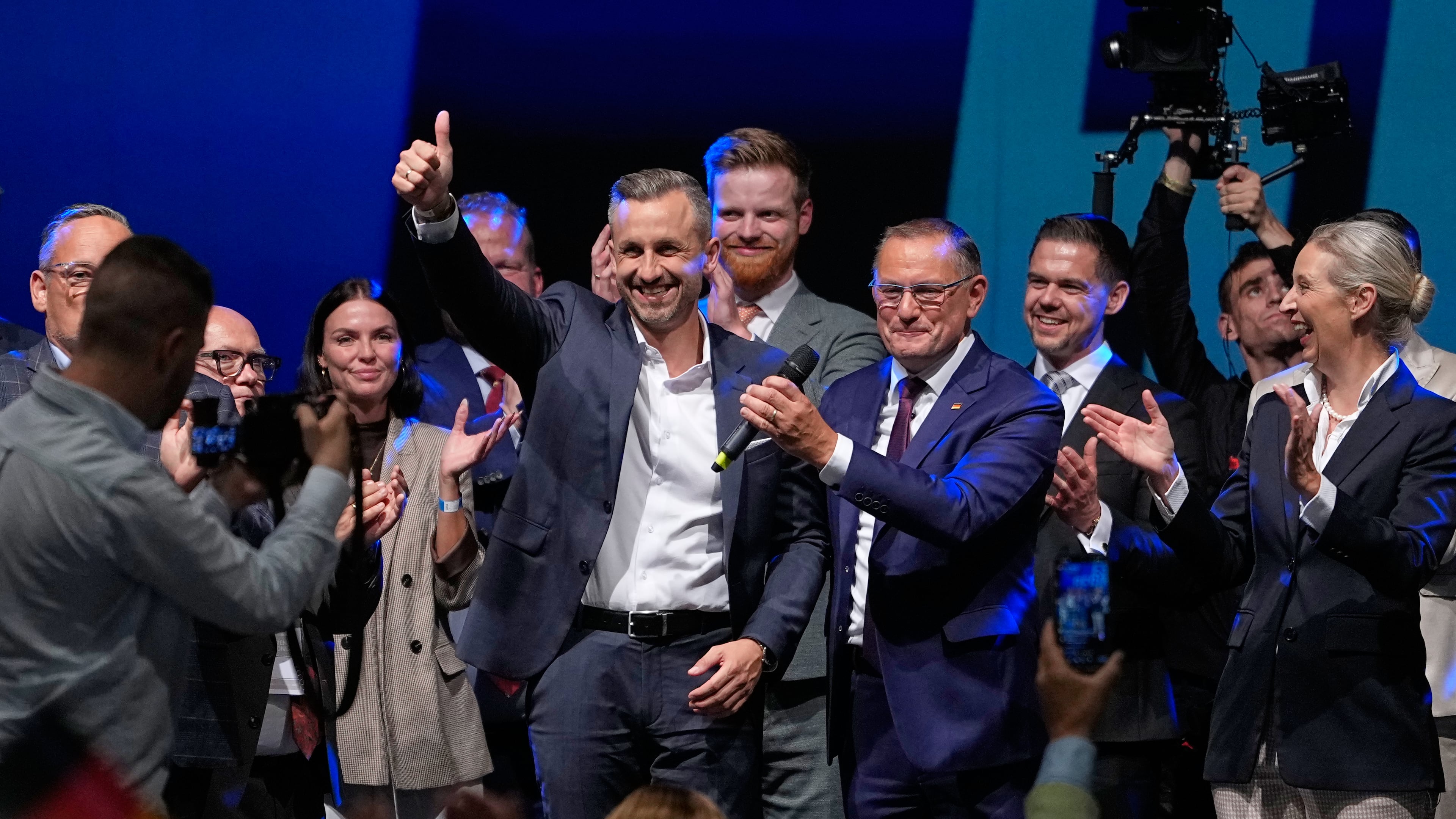 Top candidate Ulrich Siegmund shows thumbs up beside party leaders Tino Chrupalla and Alice Weidel, from left, at an election party of the "Alternative for Germany" (AfD) after the Saxony-Anhalt state elections in Magdeburg, eastern Germany, Sunday, Sept. 6, 2026. (AP Photo/Matthias Schrader)