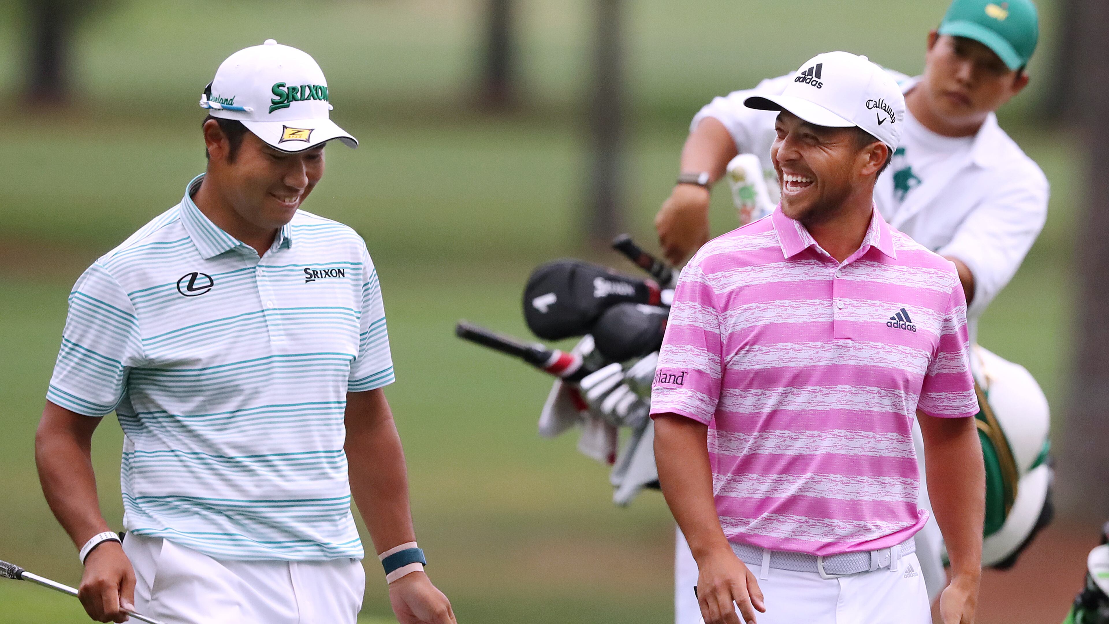 Hideki Matsuyama and Xander Schauffele share a laugh after they both made eagle putts on the 15th green during the third round of the Masters on Saturday, April 10, 2021, in Augusta. “Curtis Compton / Curtis.Compton@ajc.com”