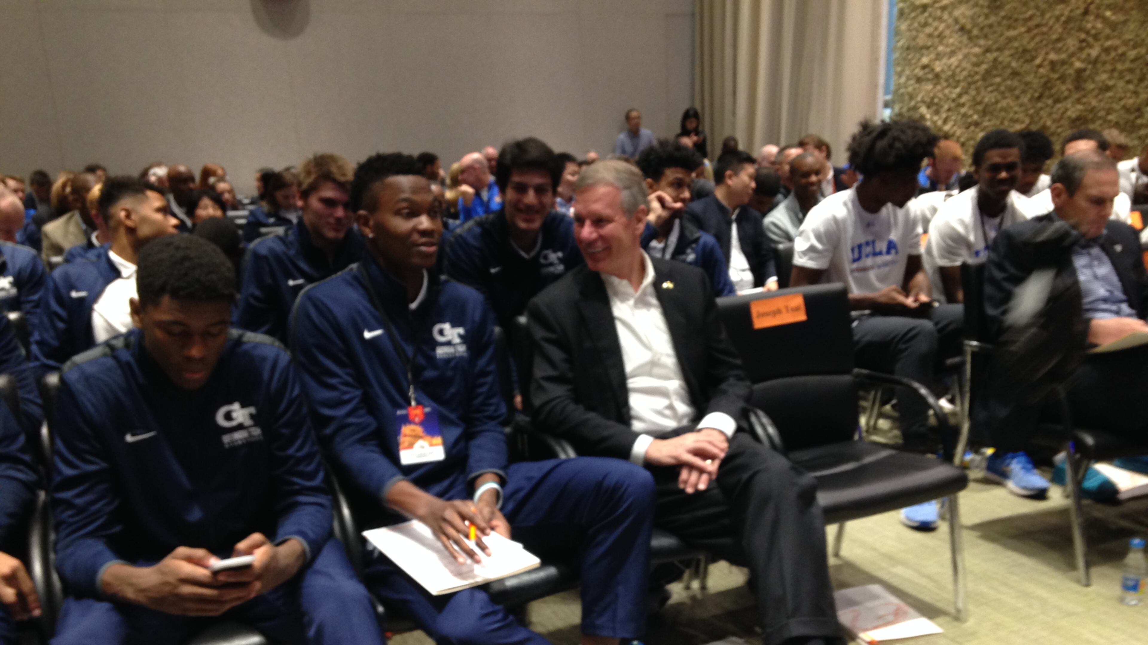 Georgia Tech forward Sylvester Ogbonda (left) and school president G.P. "Bud" Peterson share a word at the headquarters of Alibaba in Hangzhou, China, on Monday. (AJC photo by Ken Sugiura)