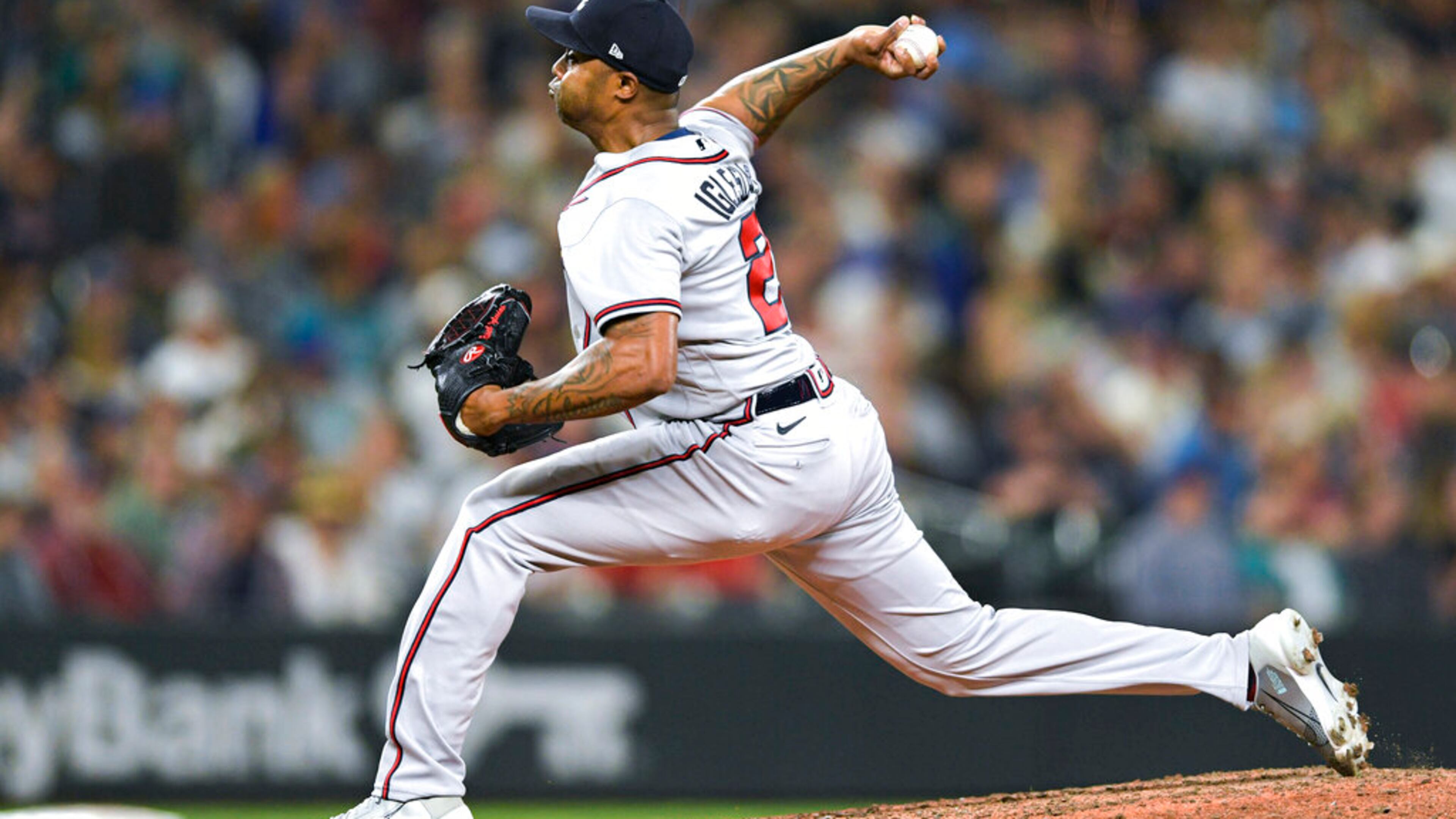Braves reliever Raisel Iglesias throws to a Mariners batter during the eighth inning Friday in Seattle. A trade that occurred minutes before the deadline changed Iglesias’ trajectory this season. (AP Photo/Caean Couto)