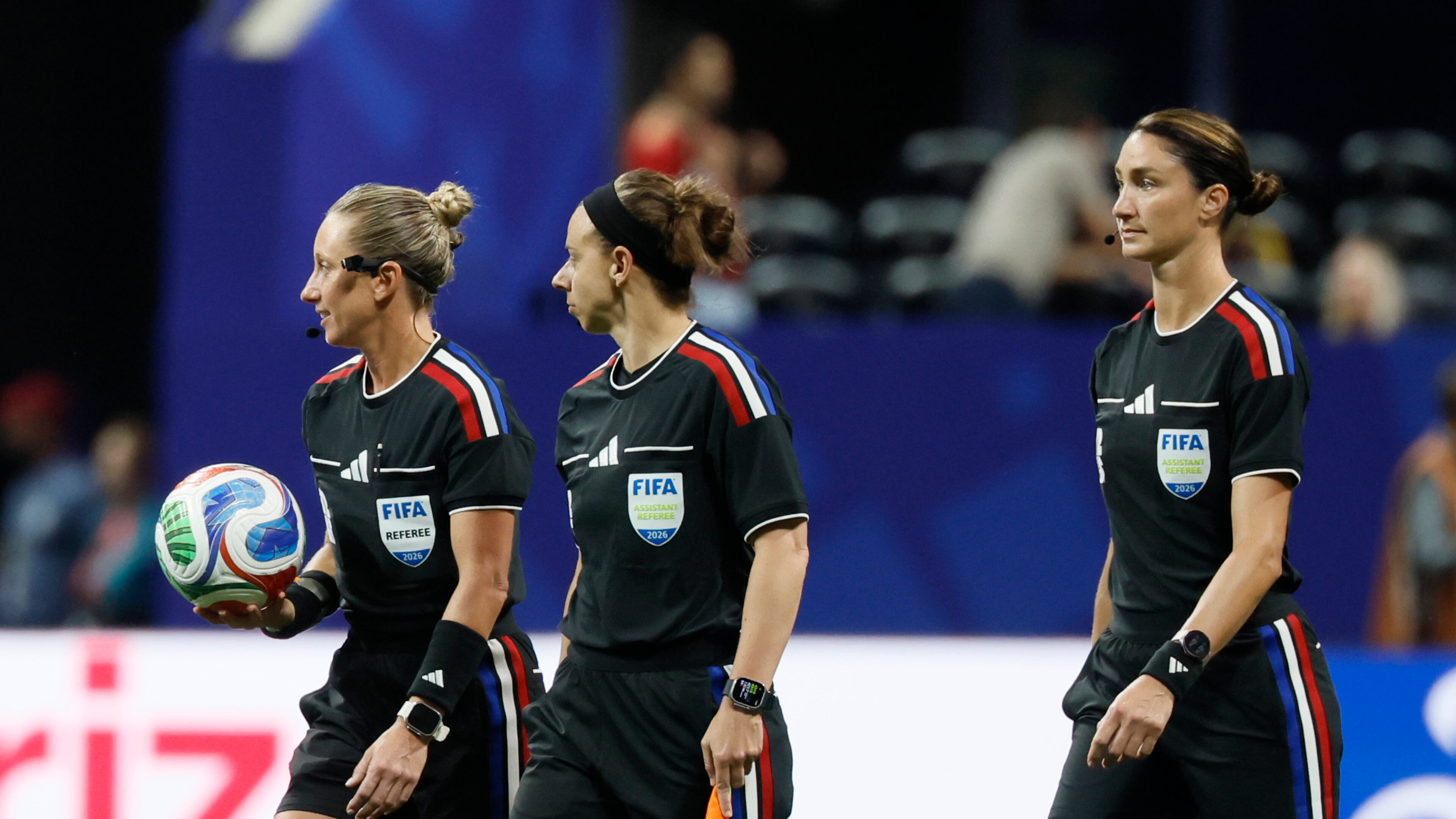 Head referee Tori Penso (left) is the first U.S. woman to be head ref at a World Cup match. She is joined by assistant referee Brooke Mayo (center) and Kathryn Nesbitt before the start of the Czechia vs. South Africa Group A FIFA World Cup match at Atlanta Stadium (Mercedes-Benz Stadium) on Thursday, June 18, 2026. (Miguel Martinez/AJC)