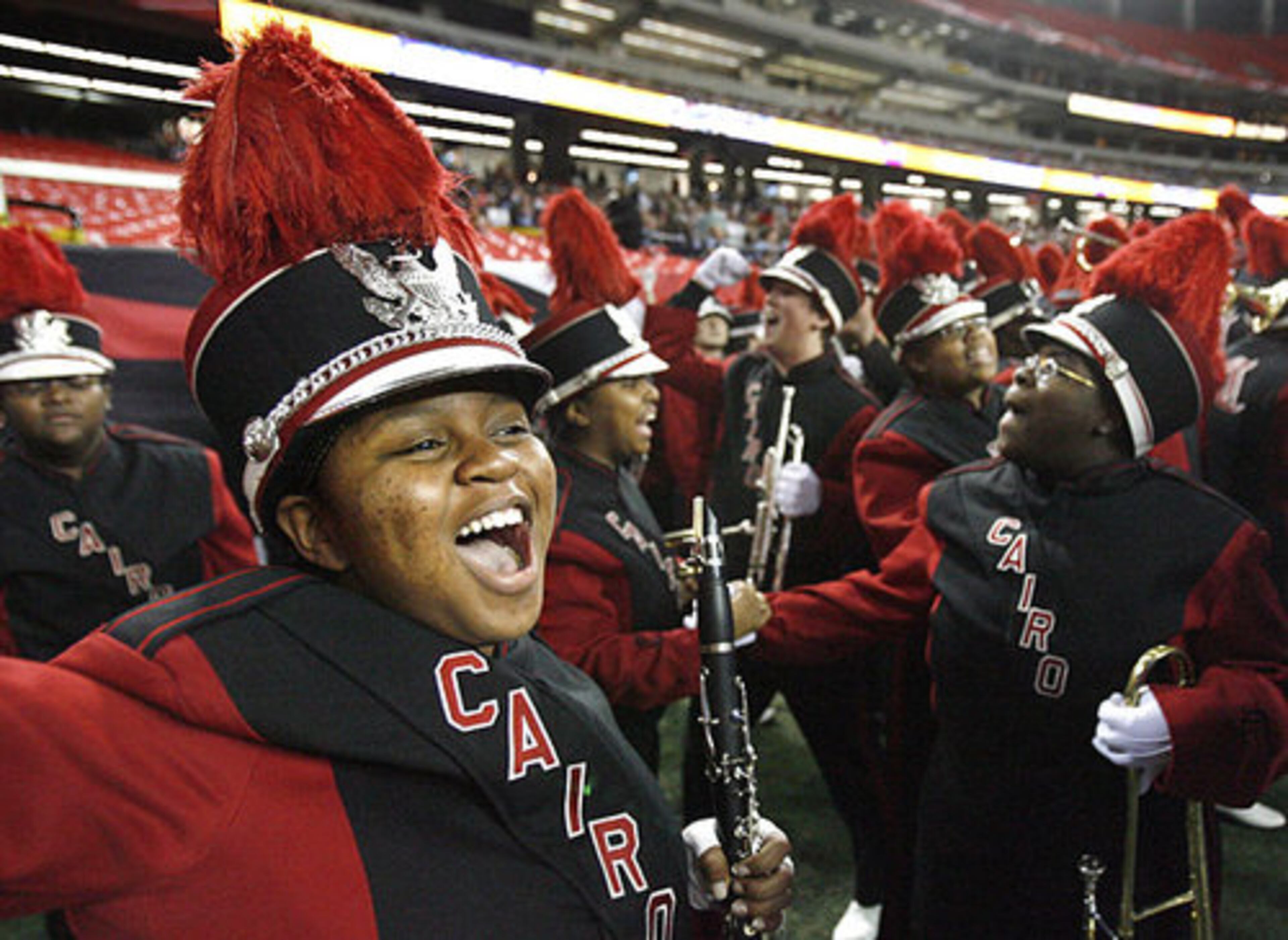 Cairo Syrupmaker band member Justina Addison, 15, reacts to Cairo's successful extra point.
