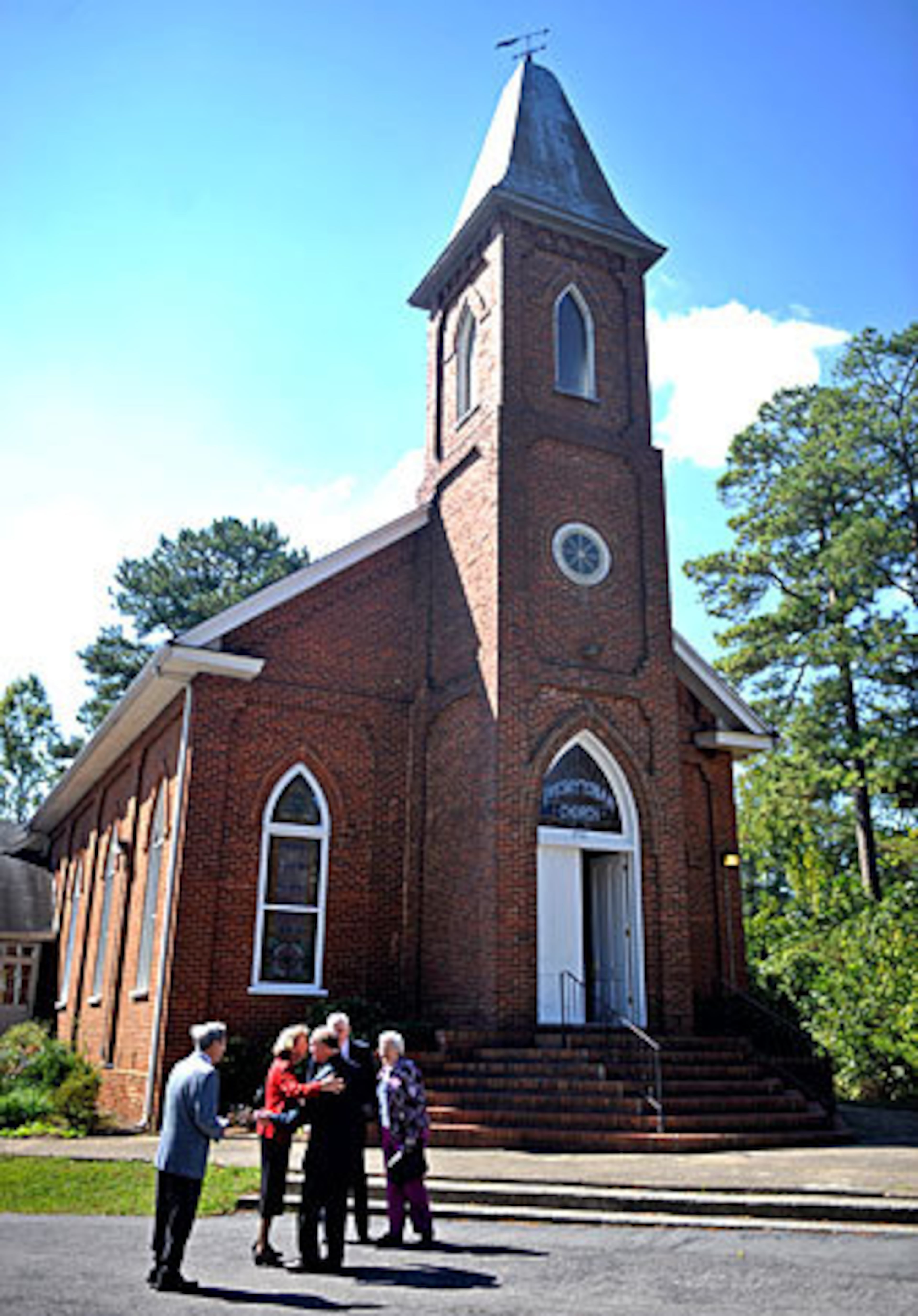 Members of Acworth Presbyterian Church greet each other after services Sunday, October 3, 2010. The church was featured in the filming of the remake of Footloose.