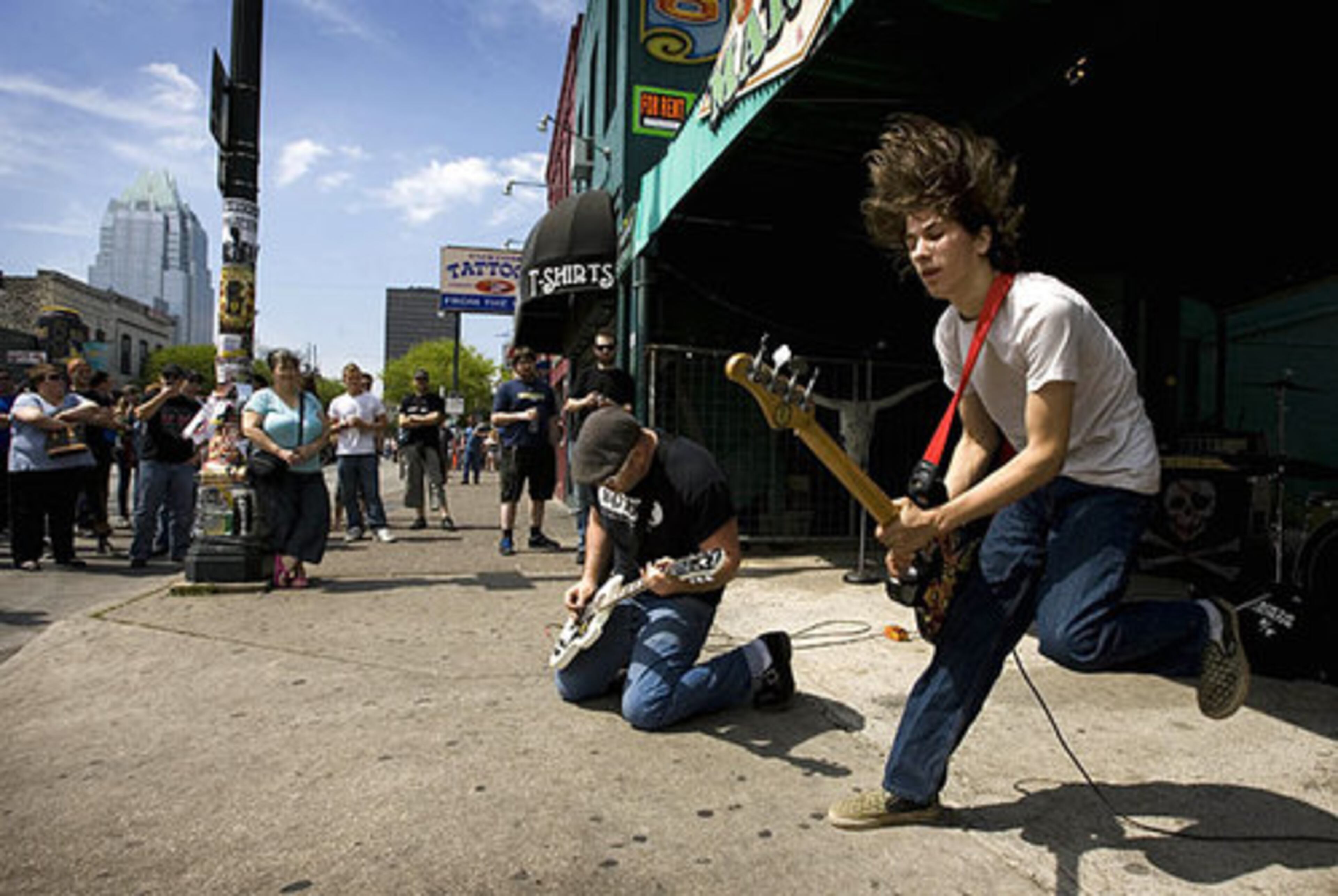 Joe Ty, left, and Jamie Attwood of the Aberdeen, Wash., band Black Top Demon perform on the sidewalk on Sixth Street at the SXSW festival.
