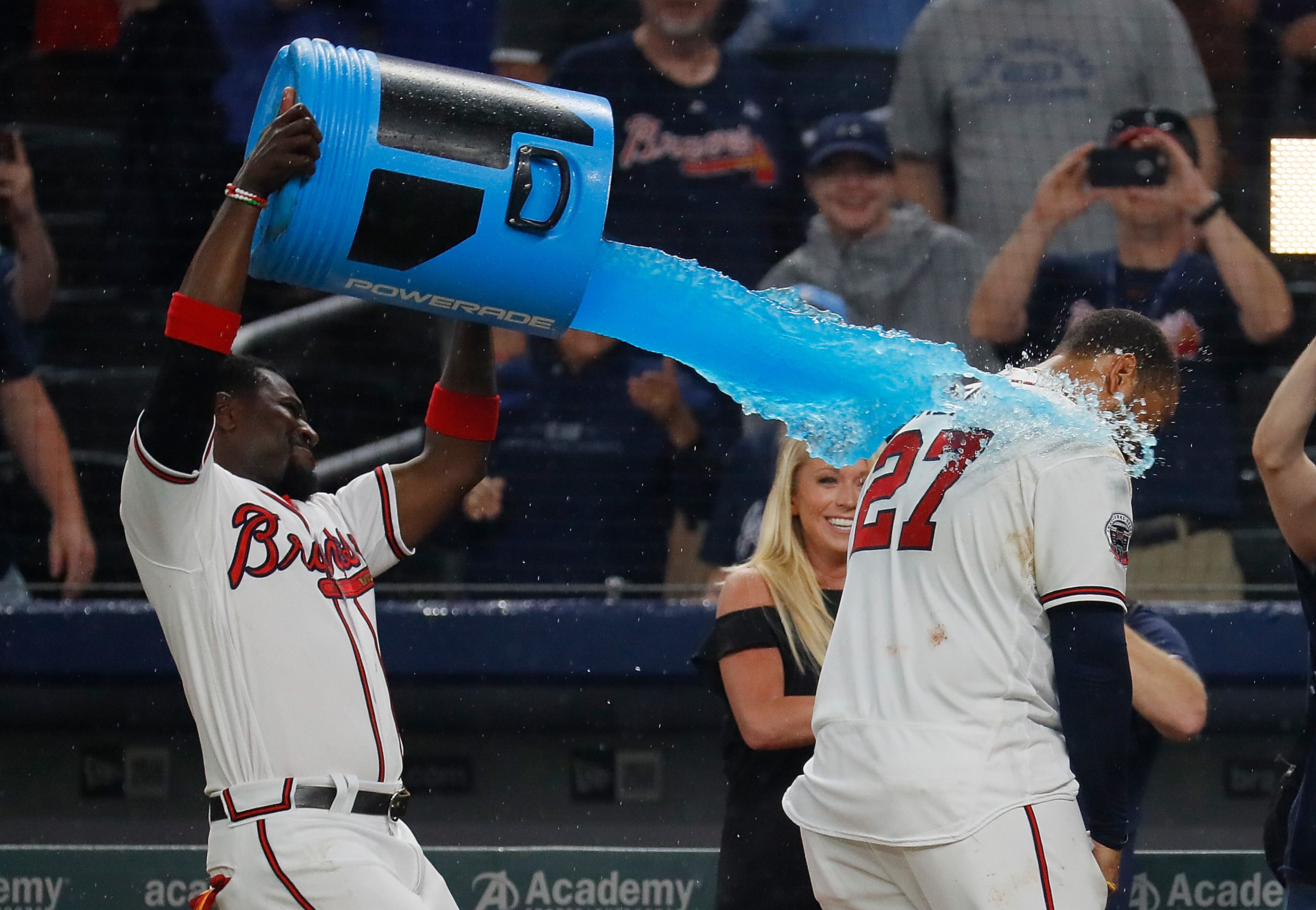 ATLANTA, GA - JUNE 21: Matt Kemp #27 of the Atlanta Braves is dunked by Brandon Phillips #4 after hitting a walk-off two-run homer in the 11th inning for a 5-3 win over the San Francisco Giants at SunTrust Park on June 21, 2017 in Atlanta, Georgia. (Photo by Kevin C. Cox/Getty Images)