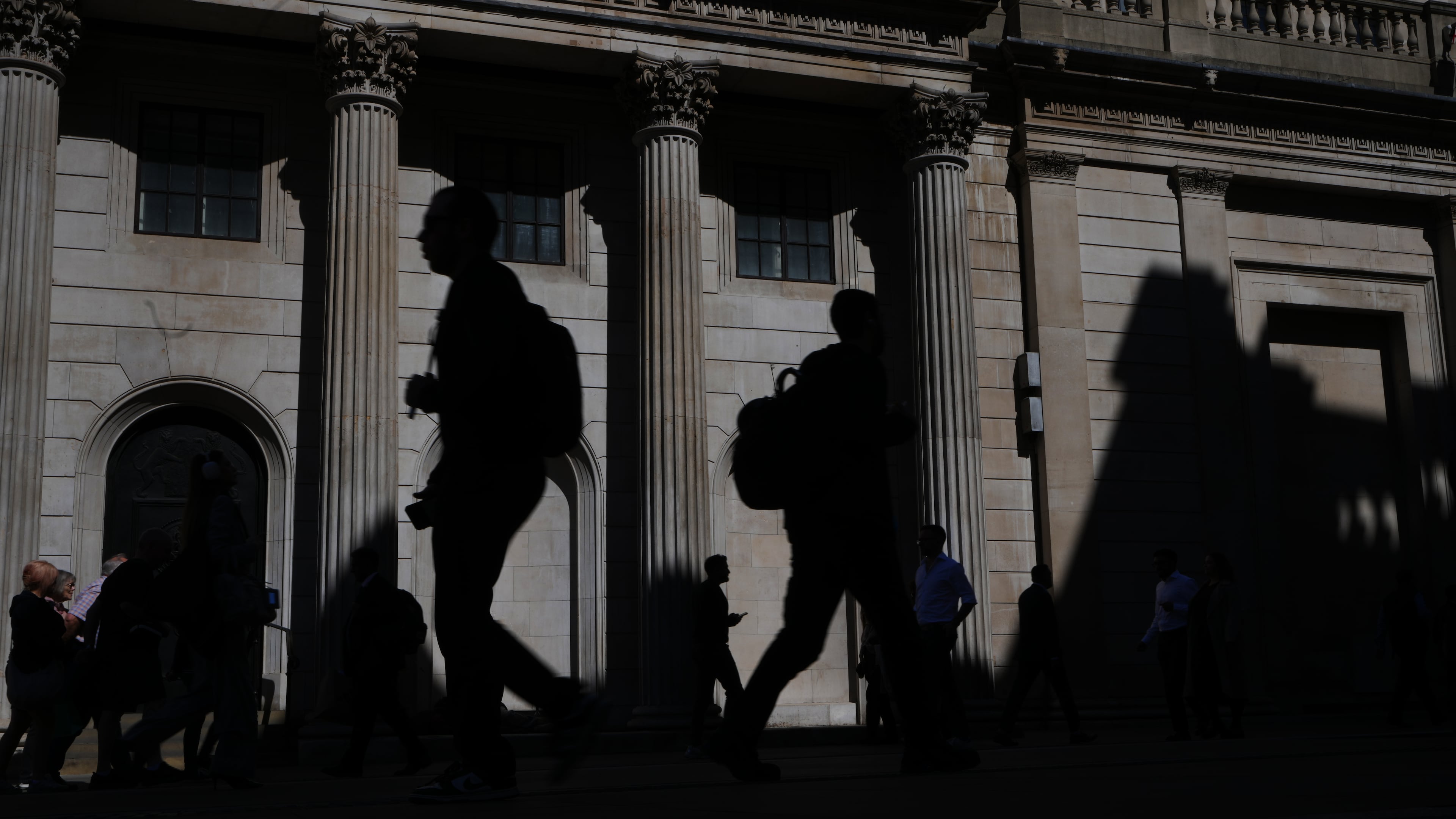 FILE -Pedestrians walk past the Bank of England in London, April 30, 2026. (AP Photo/Kirsty Wigglesworth, File)