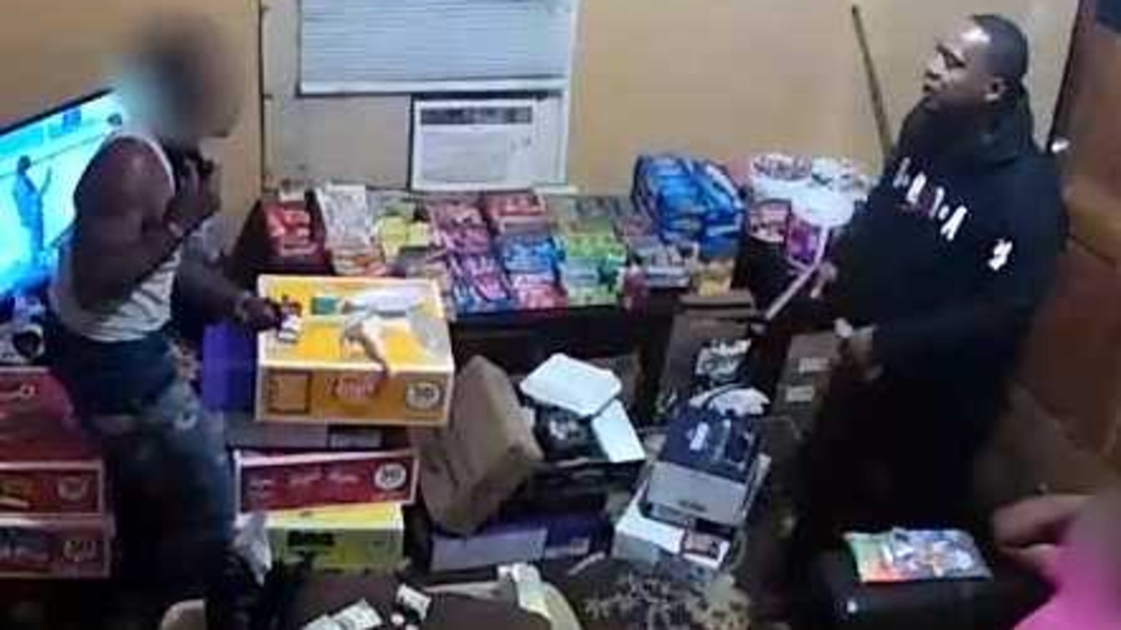 Police are looking for the suspect, right, who allegedly robbed the victim, left.