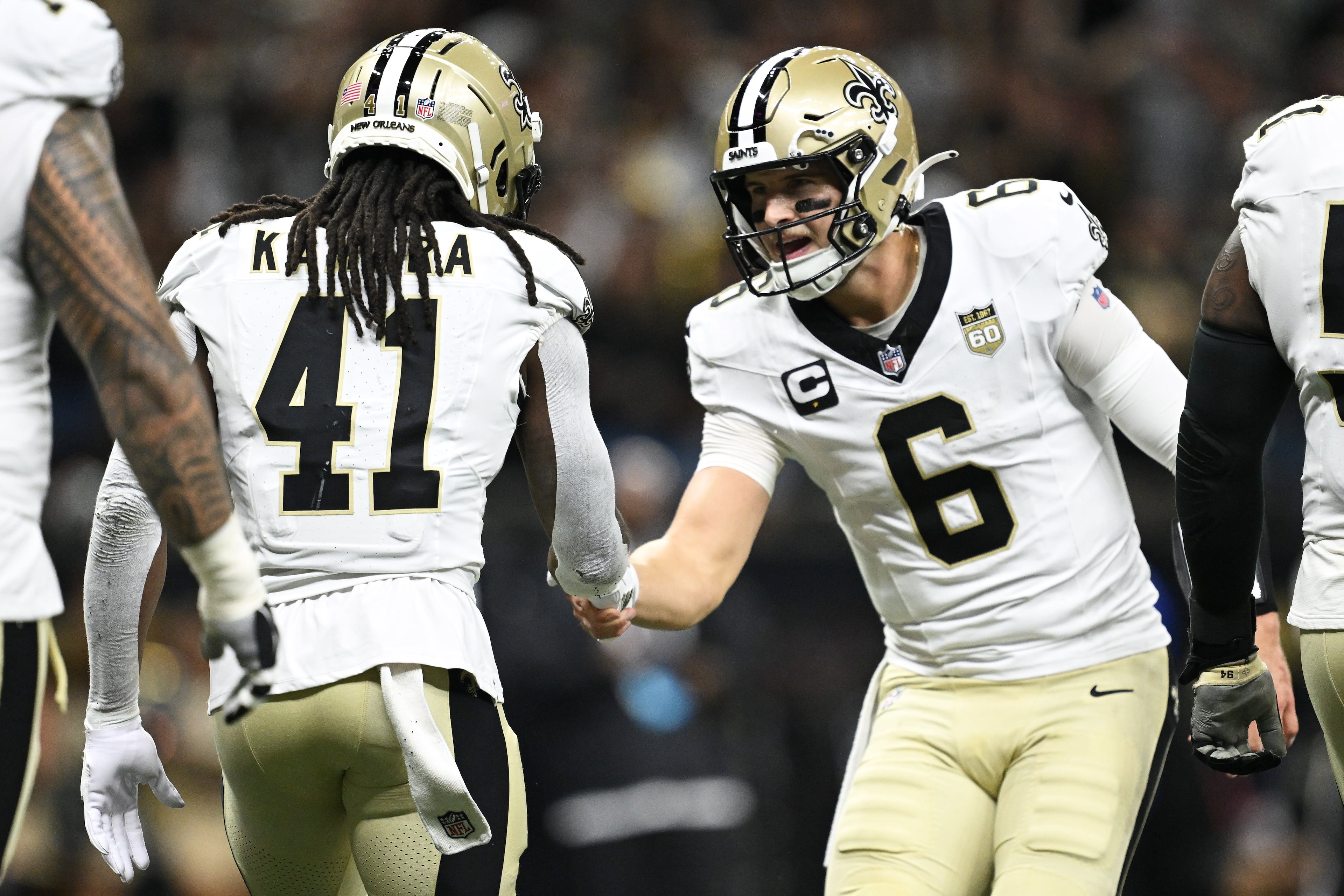 New Orleans Saints running back Alvin Kamara (left) is congratulated by quarterback Tyler Shough (right) after scoring against the Atlanta Falcons during the first half of an NFL football game in New Orleans, Monday, Oct. 5, 2026. (Ella Hall/AP)