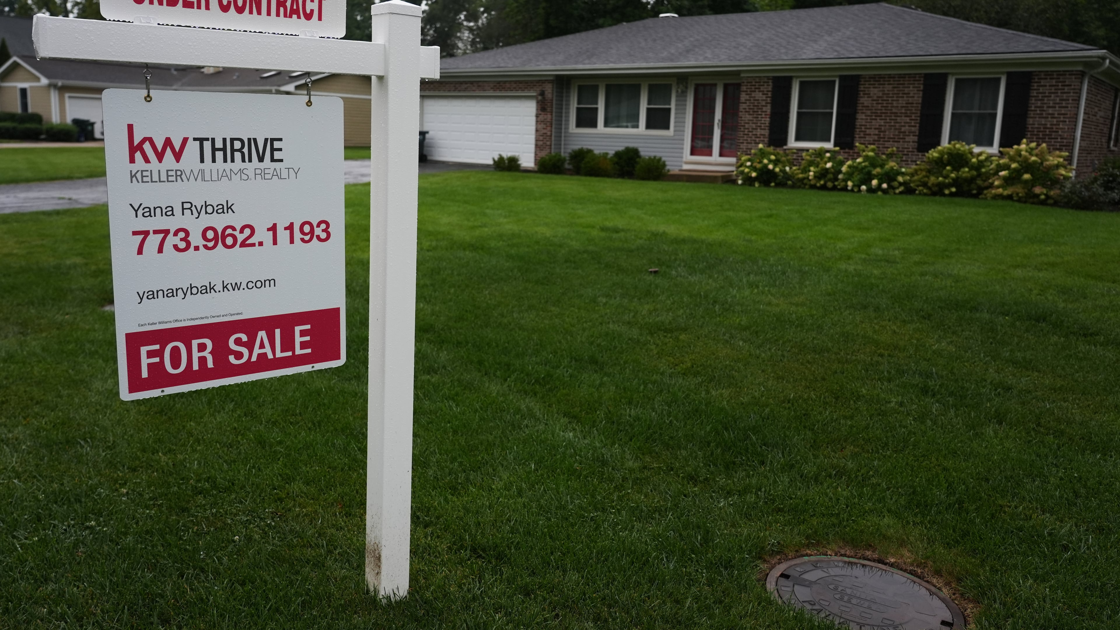 For sale sign is seen outside of a home in Arlington Heights, Ill., Wednesday, Sept. 16, 2026. (AP Photo/Nam Y. Huh)