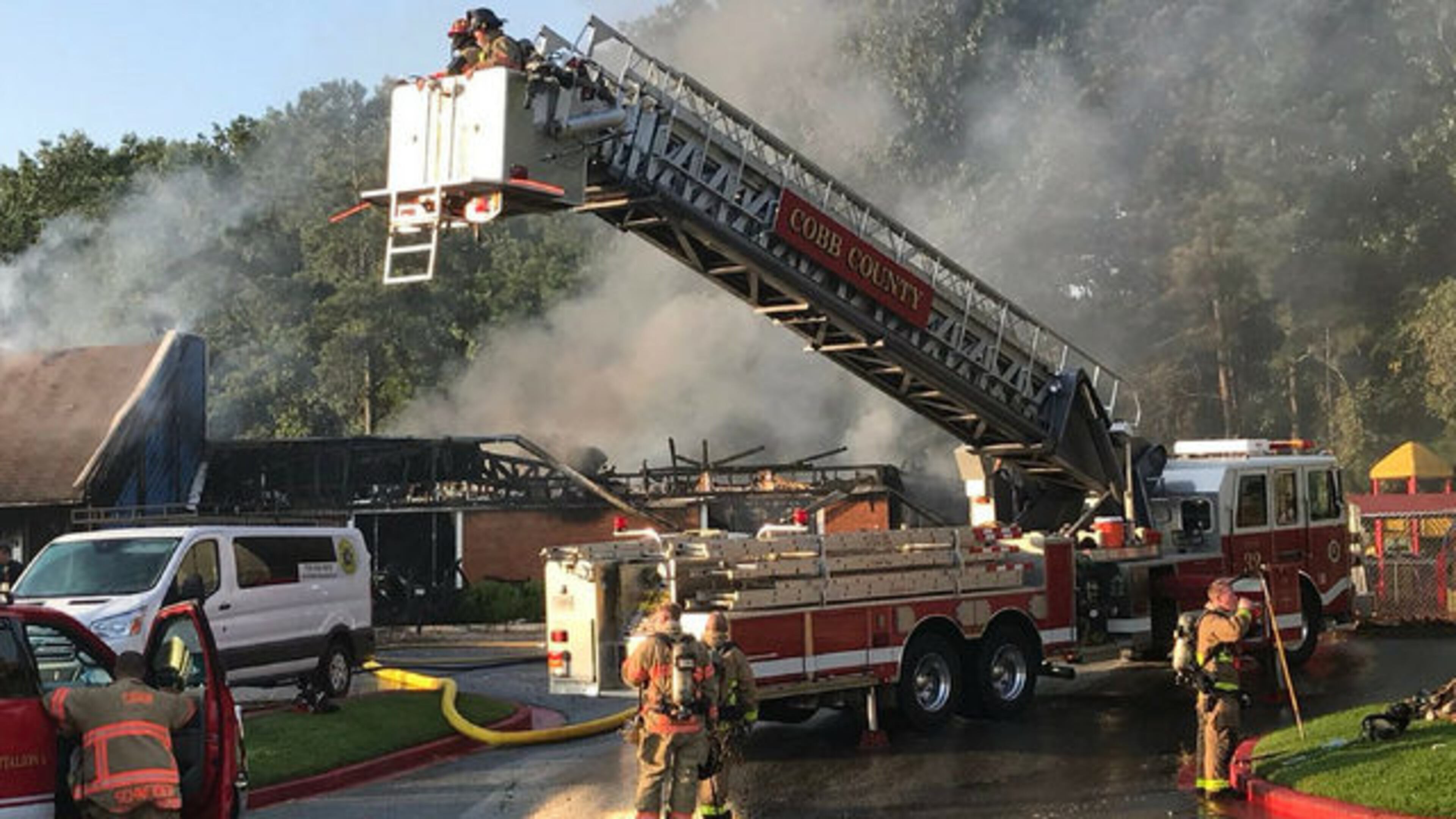 Cobb County firefighters battle a blaze at a day-care facility in Kennesaw.
