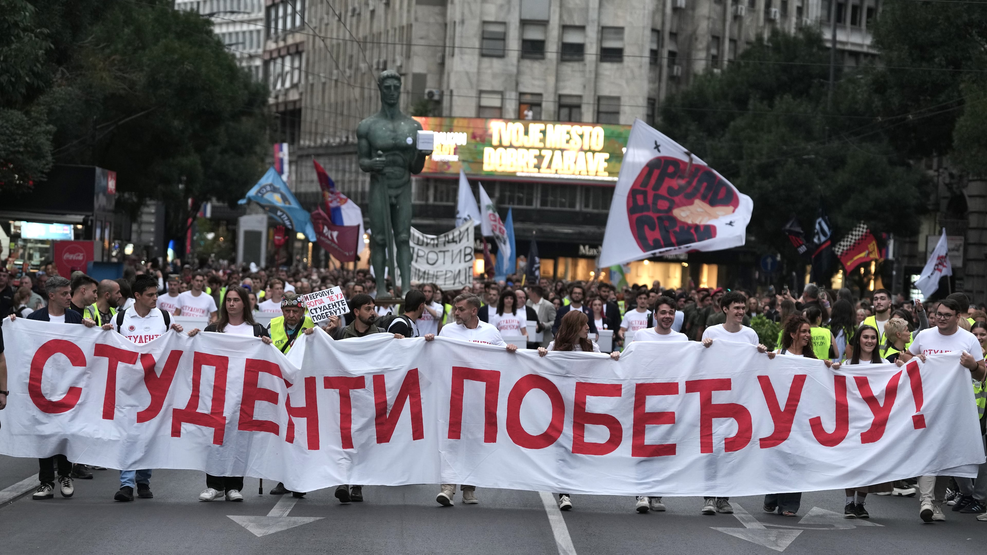 Political candidates, students and citizens carry signatures for the "Student list - Students win" to the Republic Election Commission towards participation in the upcoming parliamentary elections in Belgrade, Serbia, Monday, Sept. 14, 2026. (AP Photo/Darko Vojinovic)