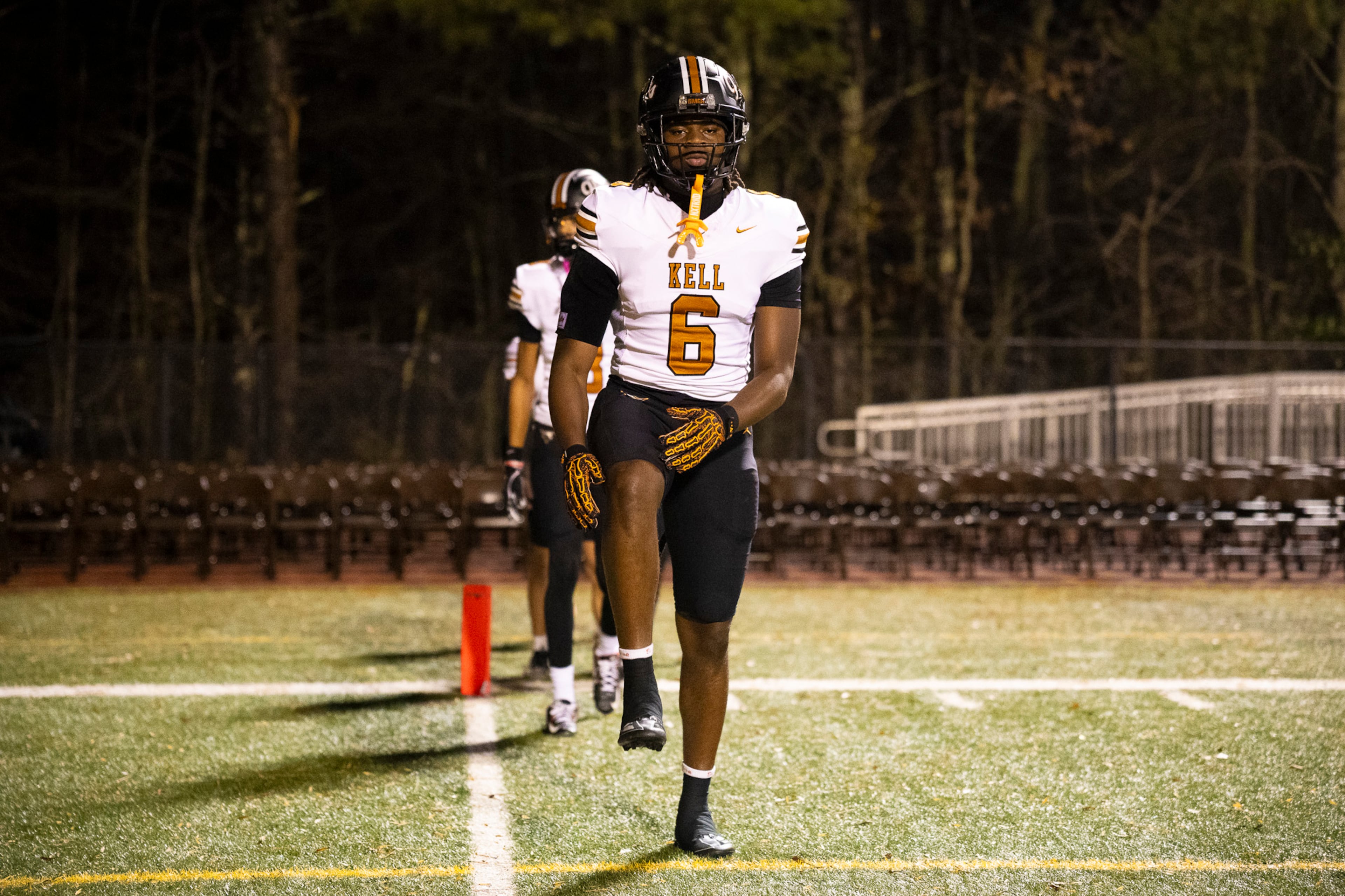 Kell tight end and Georgia Tech commit Nathan Agyemang stretches during warmups before the Class 4A semifinal against Creekside on Friday, Dec. 5, 2025, at Creekside High School in Fairburn. (Oscar Guevara Saenz for the AJC)