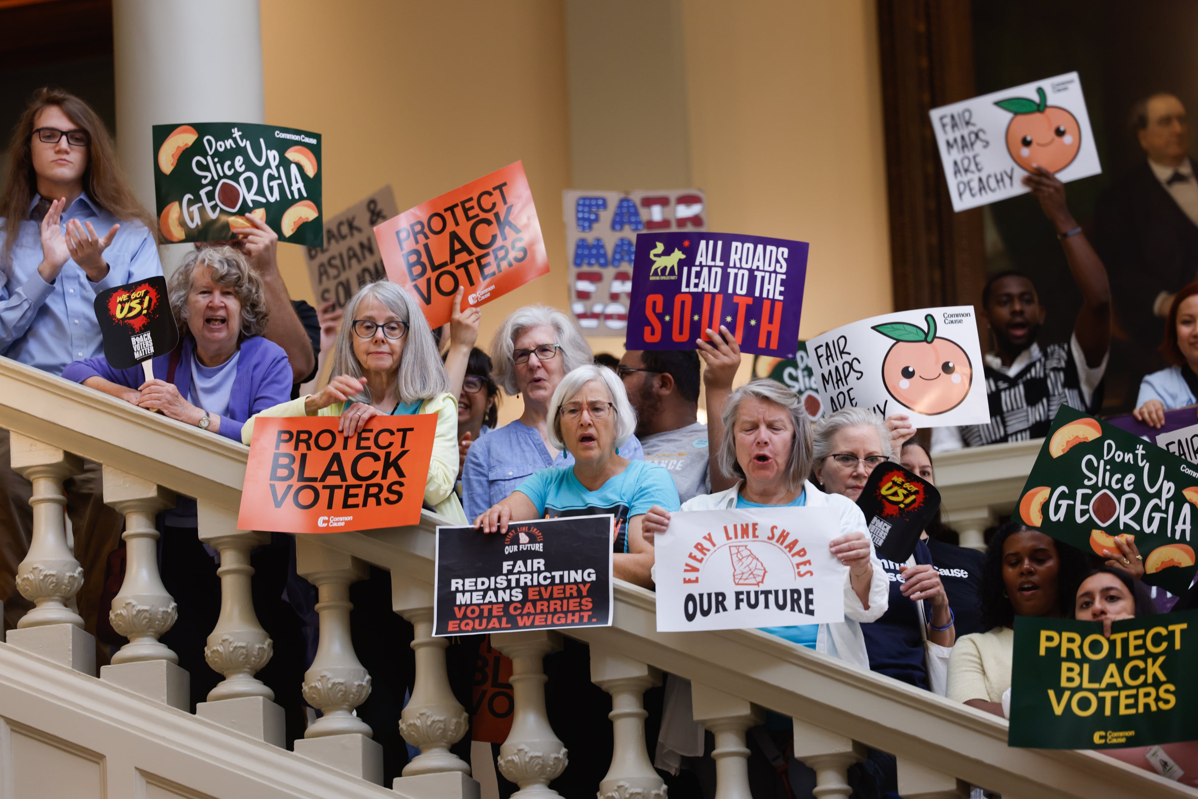 Activists opposed to redistricting gather at a press conference before the state legislature convenes for a special session in Atlanta on June 17, 2026. (Arvin Temkar/AJC)