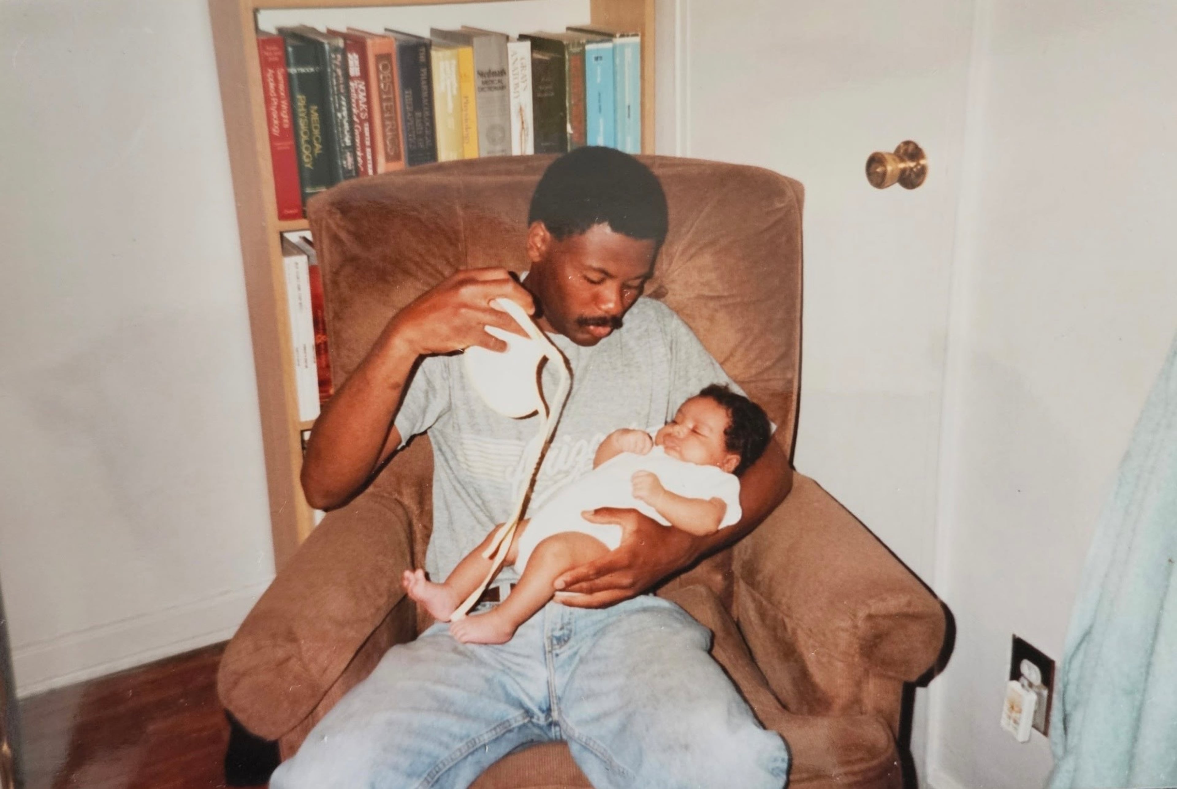 Frank Young holds his niece in this family picture from the 1990s. (Courtesy of Andrea Young)