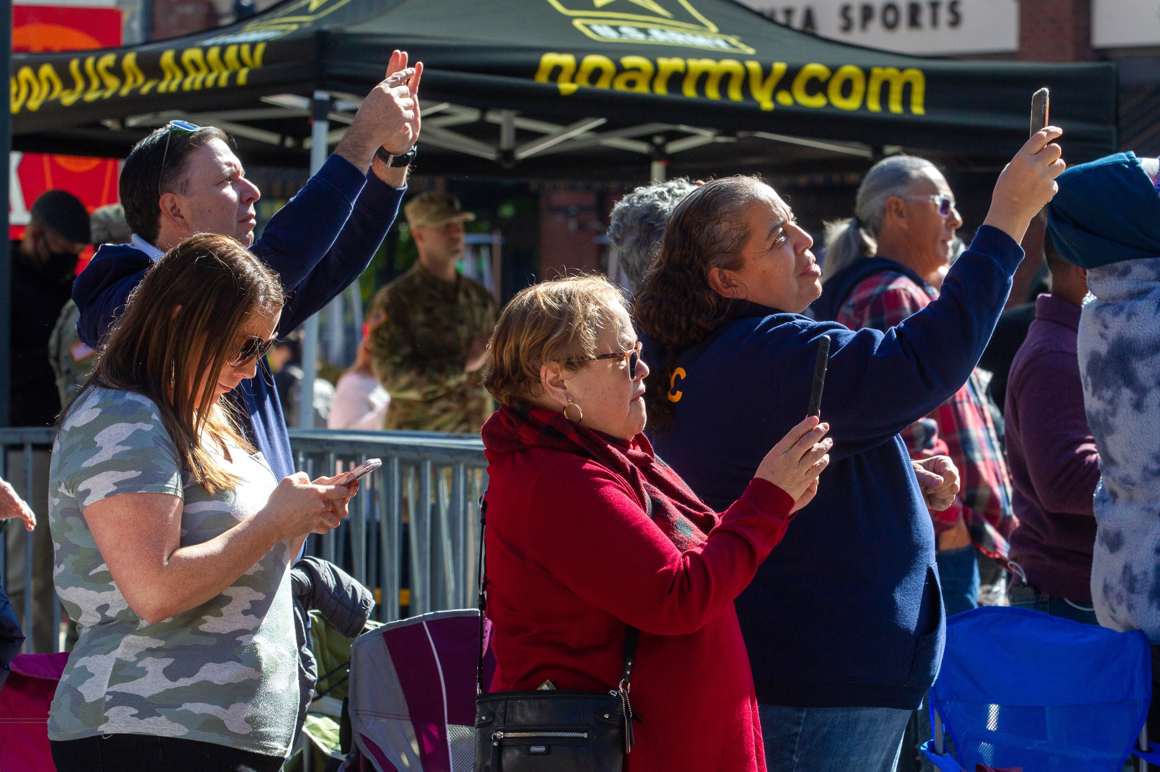 People take pictures during the 40th annual Georgia Veterans Day Parade near Truist Park on Saturday, November 6, 2021. (Photo: Steve Schaefer for The Atlanta Journal-Constitution)