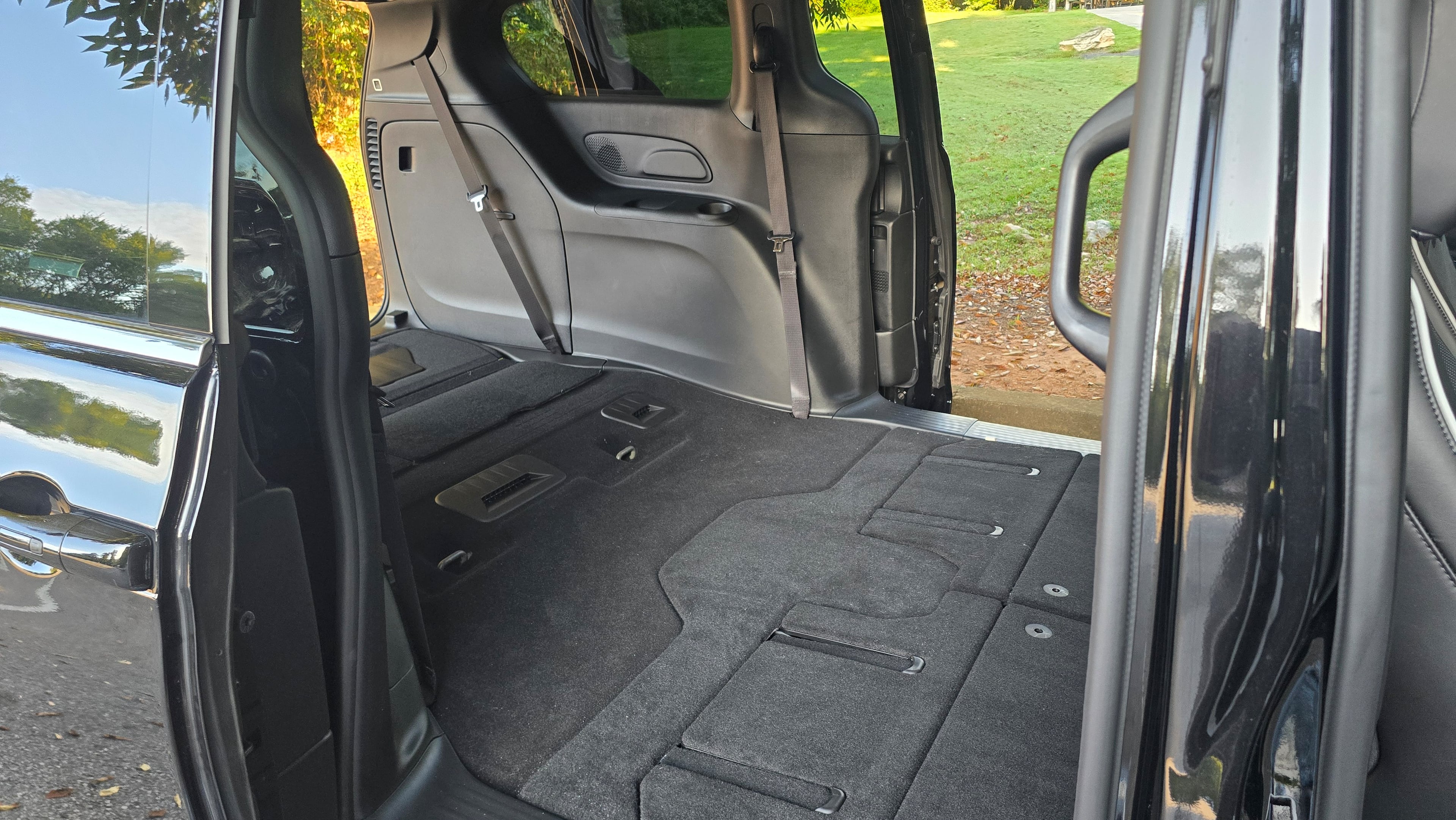 The interior of the 2027 Chrysler Pacifica with the rear seats folded flat. (Chris Hardesty/Cox Automotive)