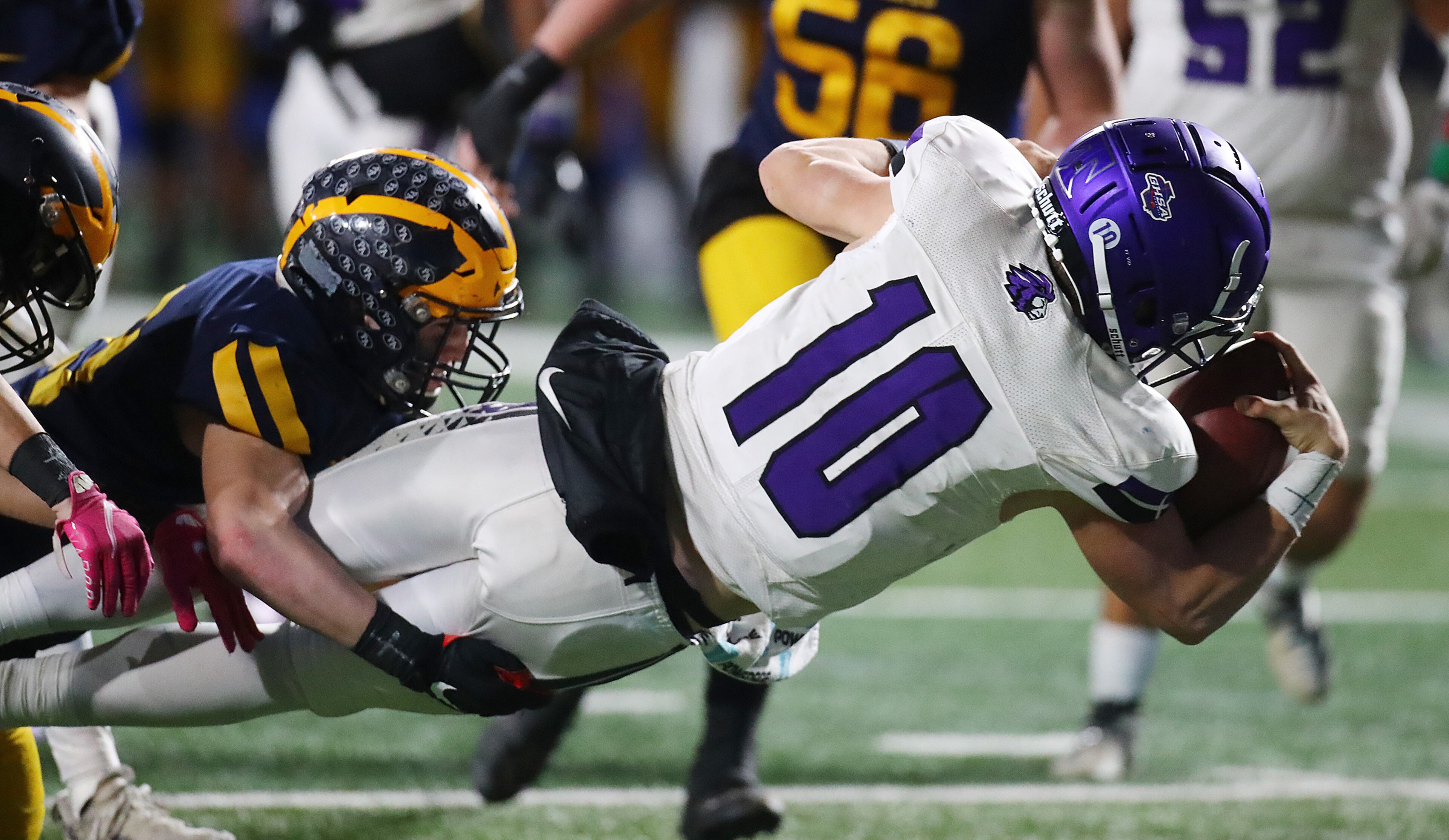 Trinity Christian quarterback David Dallas dives into the end zone on a quarterback keeper for a 49-28 lead over Prince Avenue Christian during the 4th quarter in their GHSA Class A Private Championship game on Thursday, Dec 9, 2021, in Atlanta. “Curtis Compton / Curtis.Compton@ajc.com”`