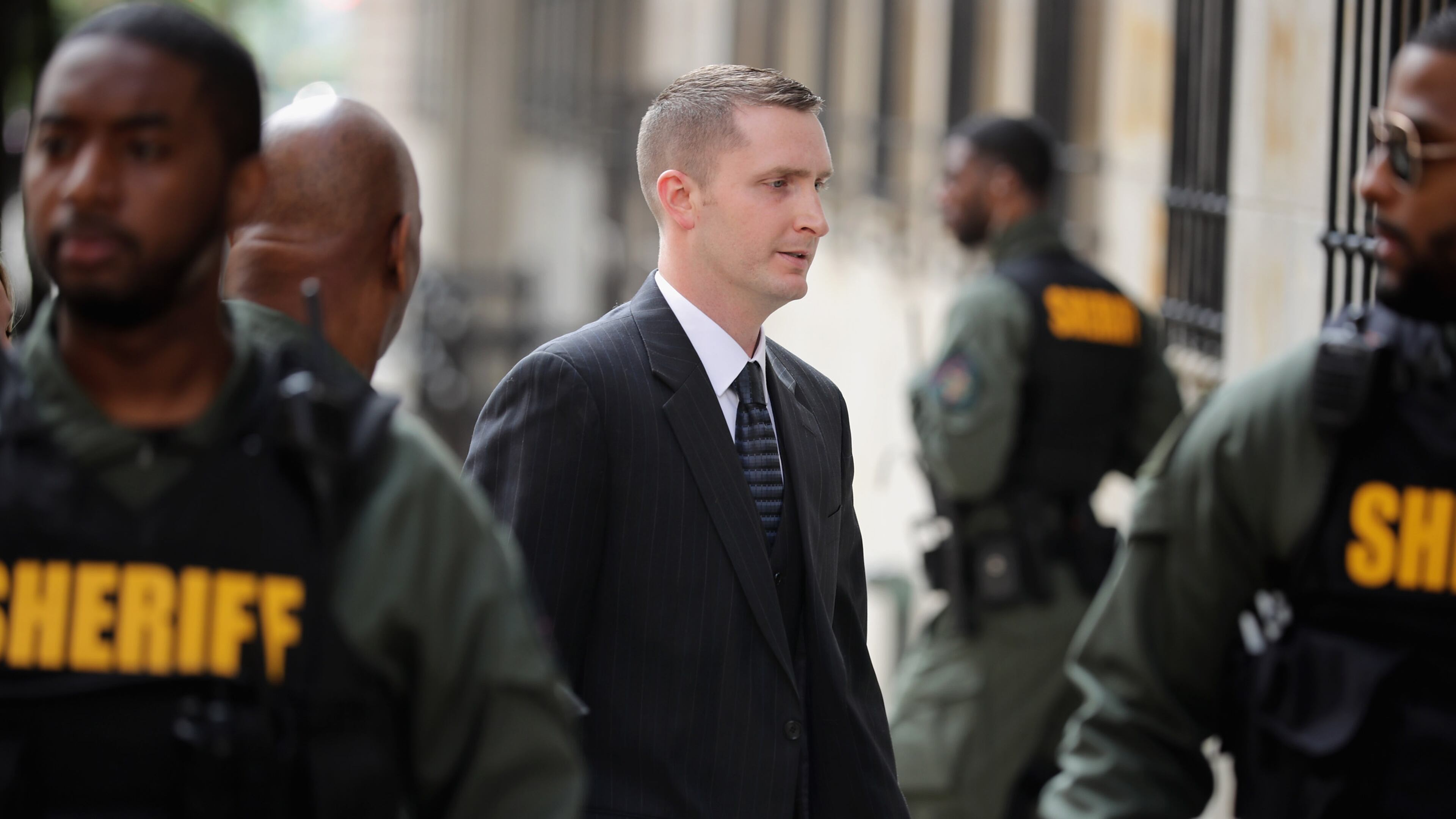 BALTIMORE, MD - MAY 23: Baltimore Police Officer Edward Nero (C) arrives at the Mitchell Courthouse-West on the day a judge will issue a vertict in his trial May 23, 2016 in Baltimore, Maryland. Nero is one of six police officers charged in the arrest and death of Freddie Gray, whose injuries while in police custody resluted in his death and sparked days of protests and riots in Baltimore last year. (Photo by Chip Somodevilla/Getty Images)