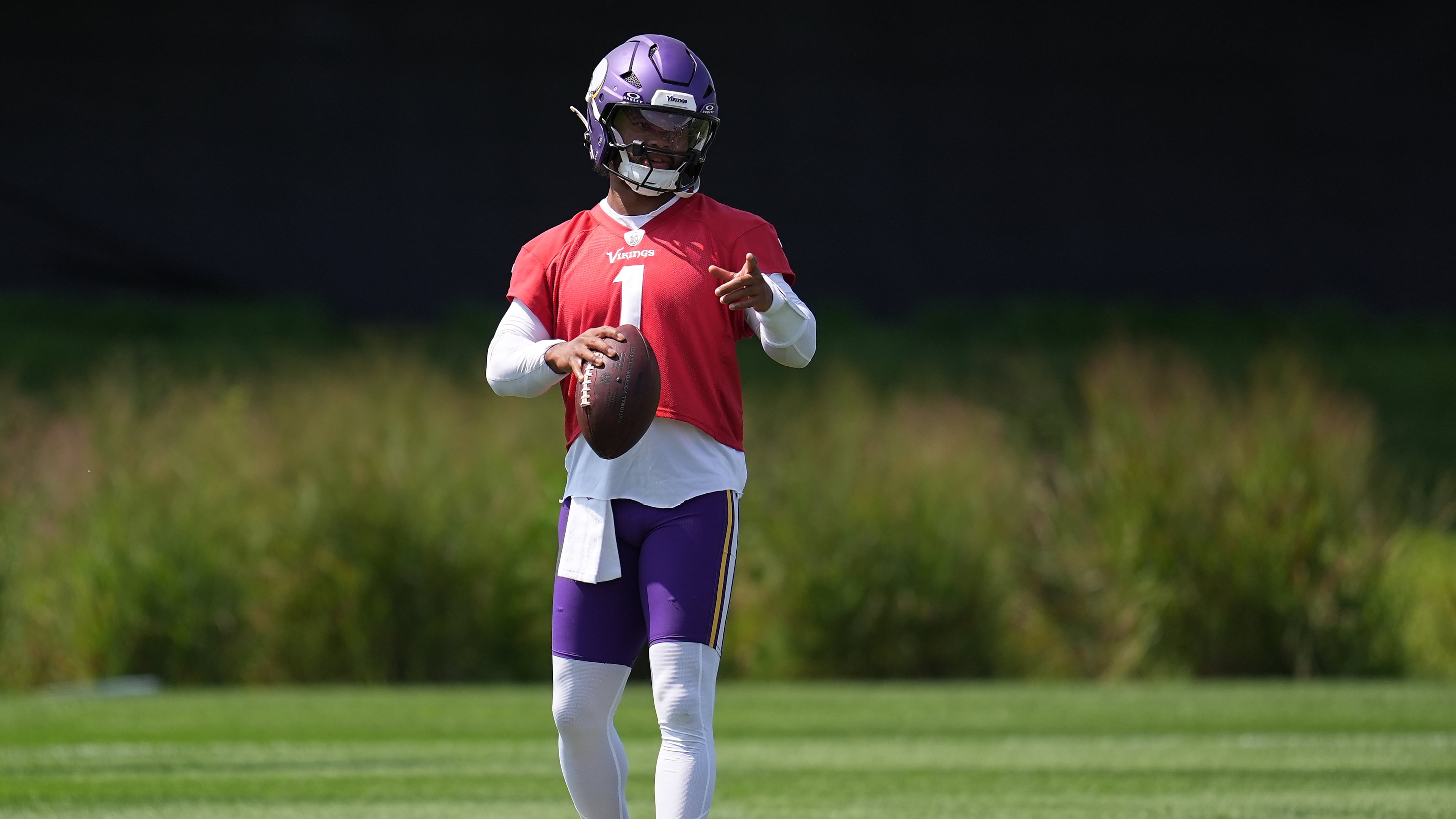 Minnesota Vikings quarterback Kyler Murray stands on the field during the NFL football team's training camp Saturday, Aug. 1, 2026, in Eagan, Minn. (AP Photo/Abbie Parr)