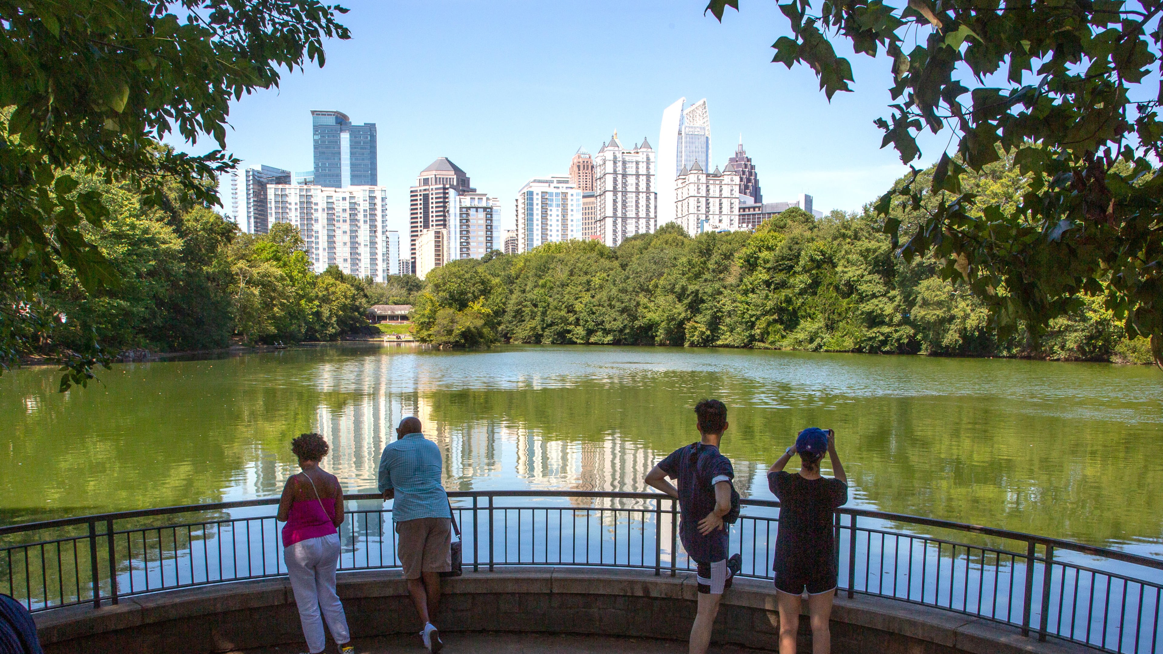 People photograph the Atlanta skyline during the Atlanta Jazz Festival in Piedmont Park on Sunday, September 5, 2021. STEVE SCHAEFER FOR THE ATLANTA JOURNAL-CONSTITUTION