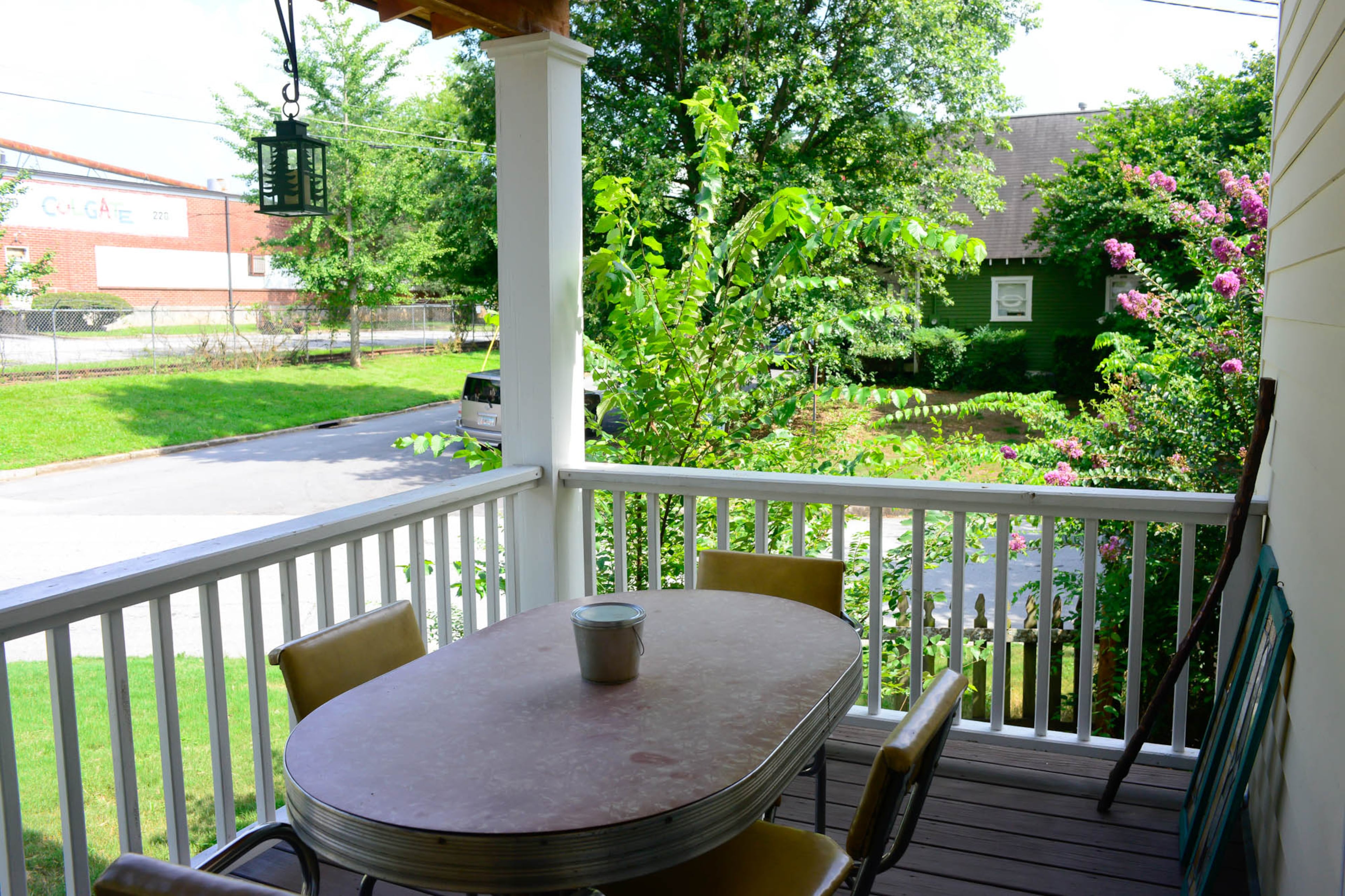 The front porch encourages people to be social and to have a community, said actress and Cabbagetown resident Amber Nash. An old kitchen table, a 1950s classic with an aluminum ring, and vintage vinyl chairs offer seating for themselves and neighbors.