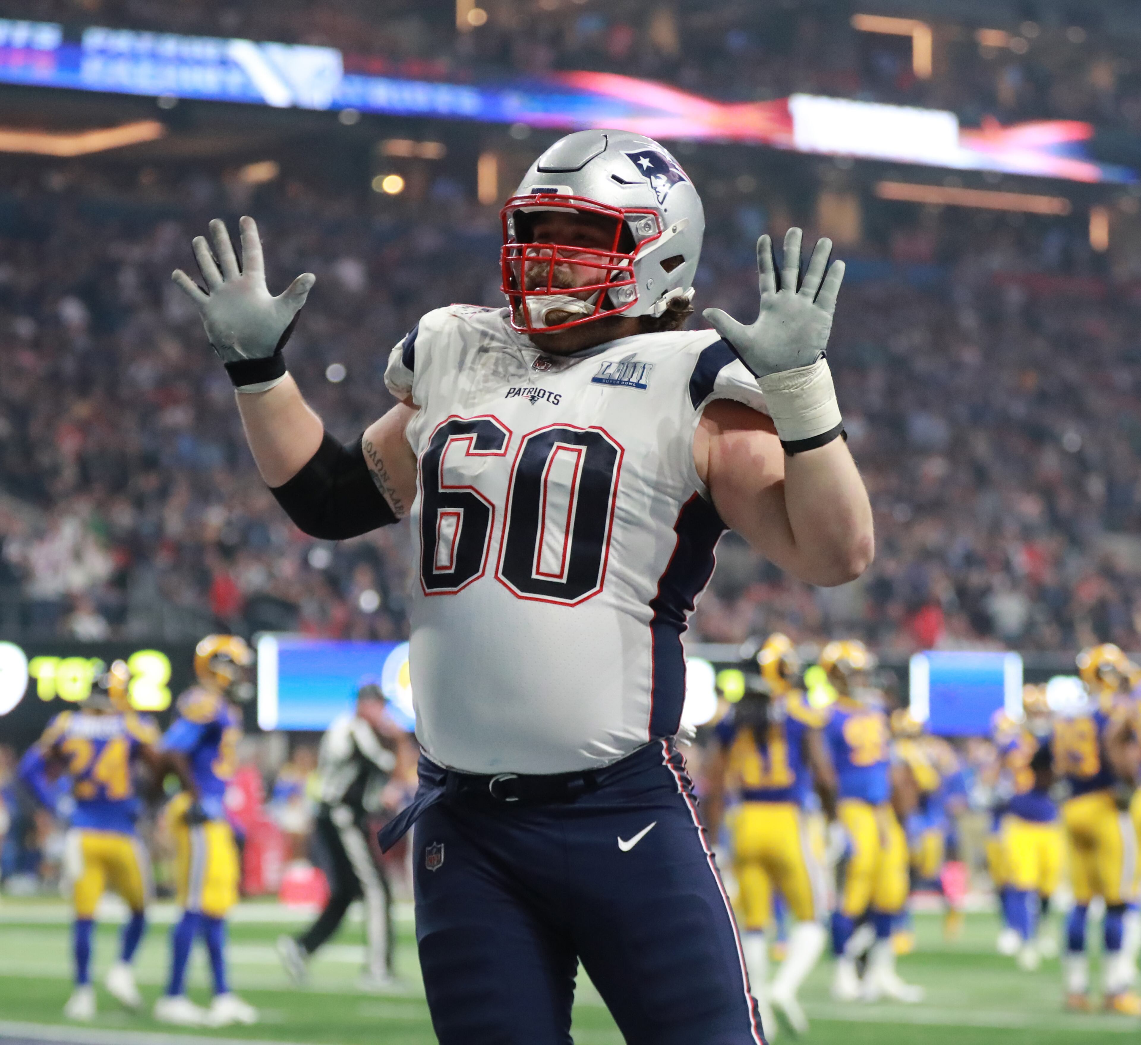 2/3/19 - Atlanta - New England Patriots center David Andrews (60) celebrates a fourth quarter touchdown made by New England Patriots running back Sony Michel (26) against the Los Angeles Rams on Sunday, Feb. 3, 2019 in Super Bowl LIII at Mercedes-Benz Stadium in Atlanta, Ga. 
CURTIS COMPTON / CCOMPTON@AJC.COM
