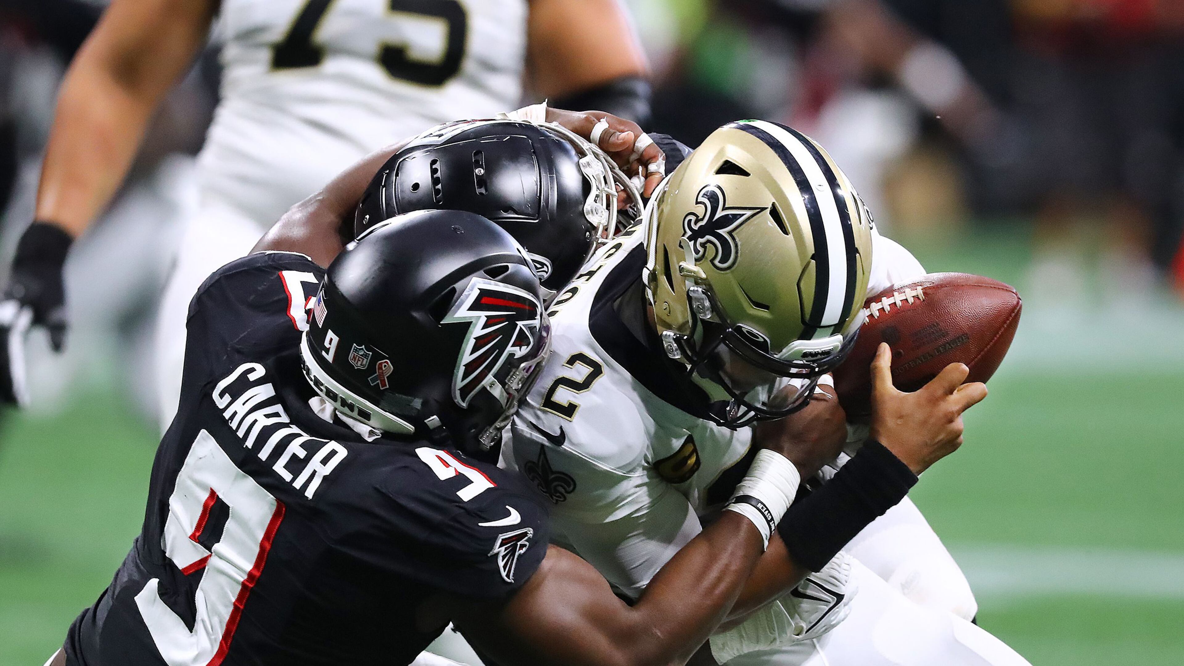 Atlanta Falcons outside linebacker Lorenzo Carter and defensive lineman Grady Jarrett sack New Orleans Saints quarterback Jameis Winston for a loss on third down during the second quarter Sunday, Sept. 11, 2022, in Atlanta. (Curtis Compton/The Atlanta Journal-Constitution/TNS)