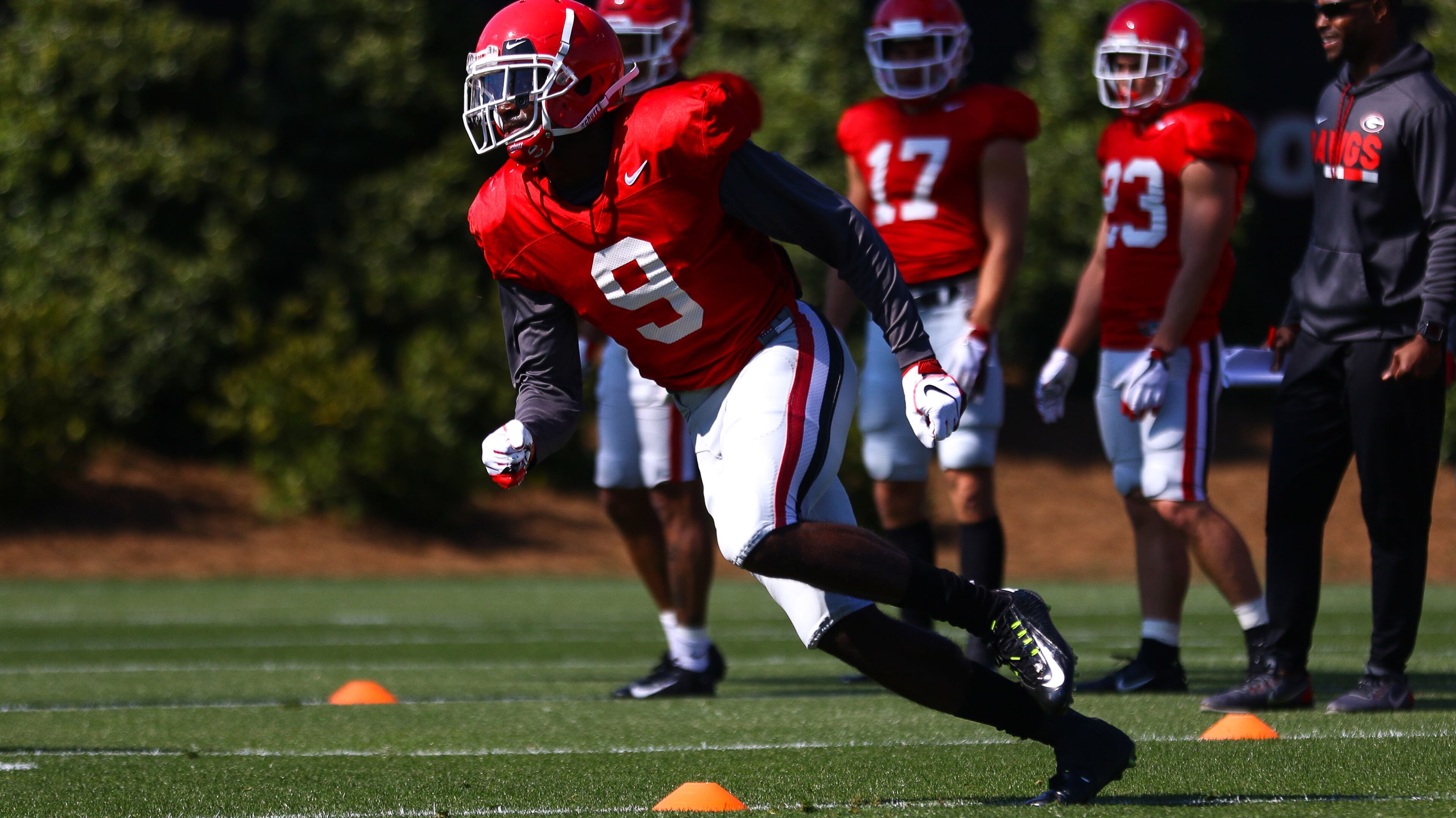 Georgia wide receiver Jeremiah Holloman (9) rounds a cone during a footwork drill at spring practice Tuesday, April 2, 2019, in Athens.