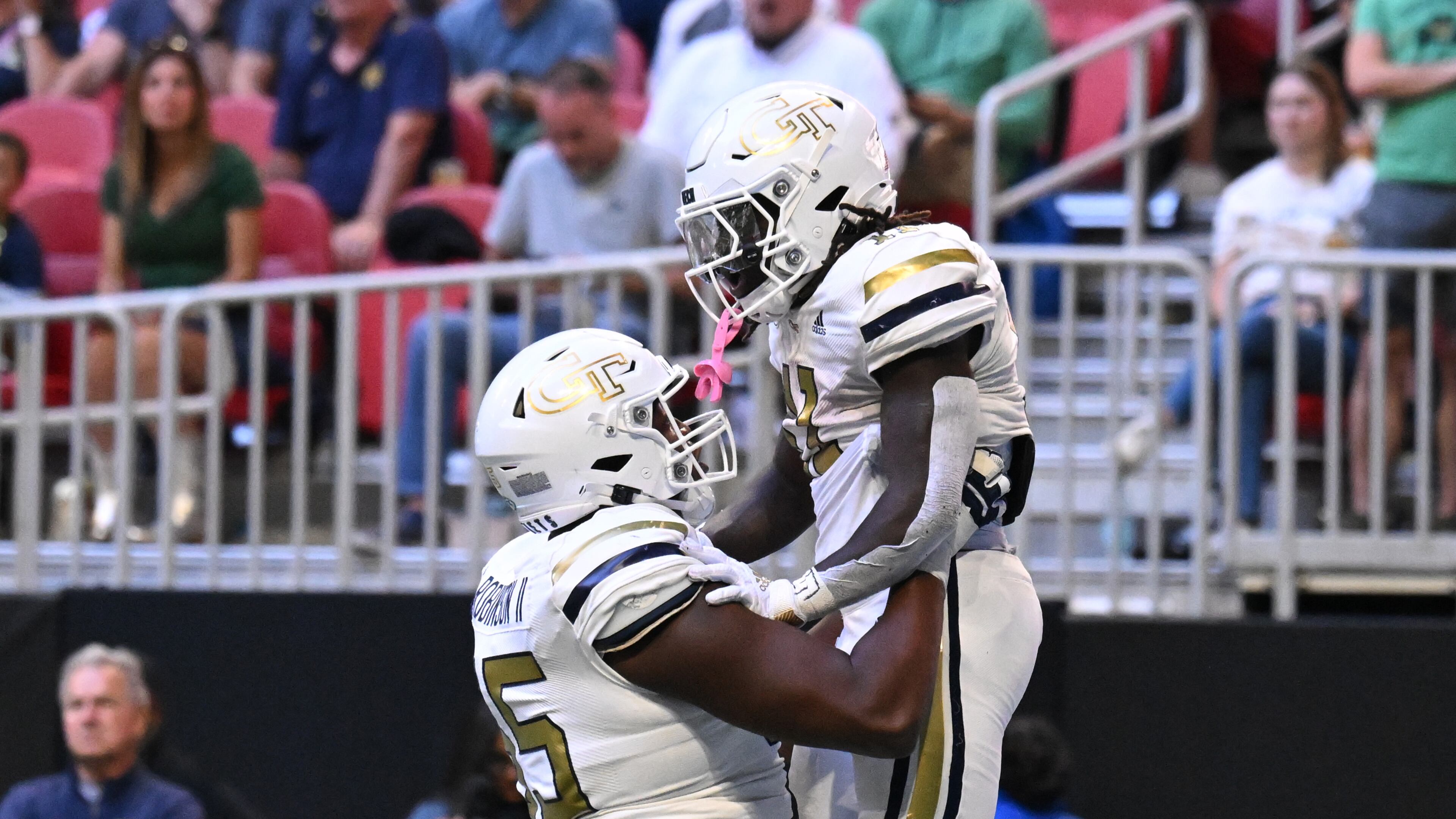 Georgia Tech running back Jamal Haynes (11) celebrates by a teammate after scoring a touchdown run during the first half in an NCAA football game at Mercedes-Benz Stadium, Saturday, October 19, 2024, in Atlanta. (Hyosub Shin / AJC)