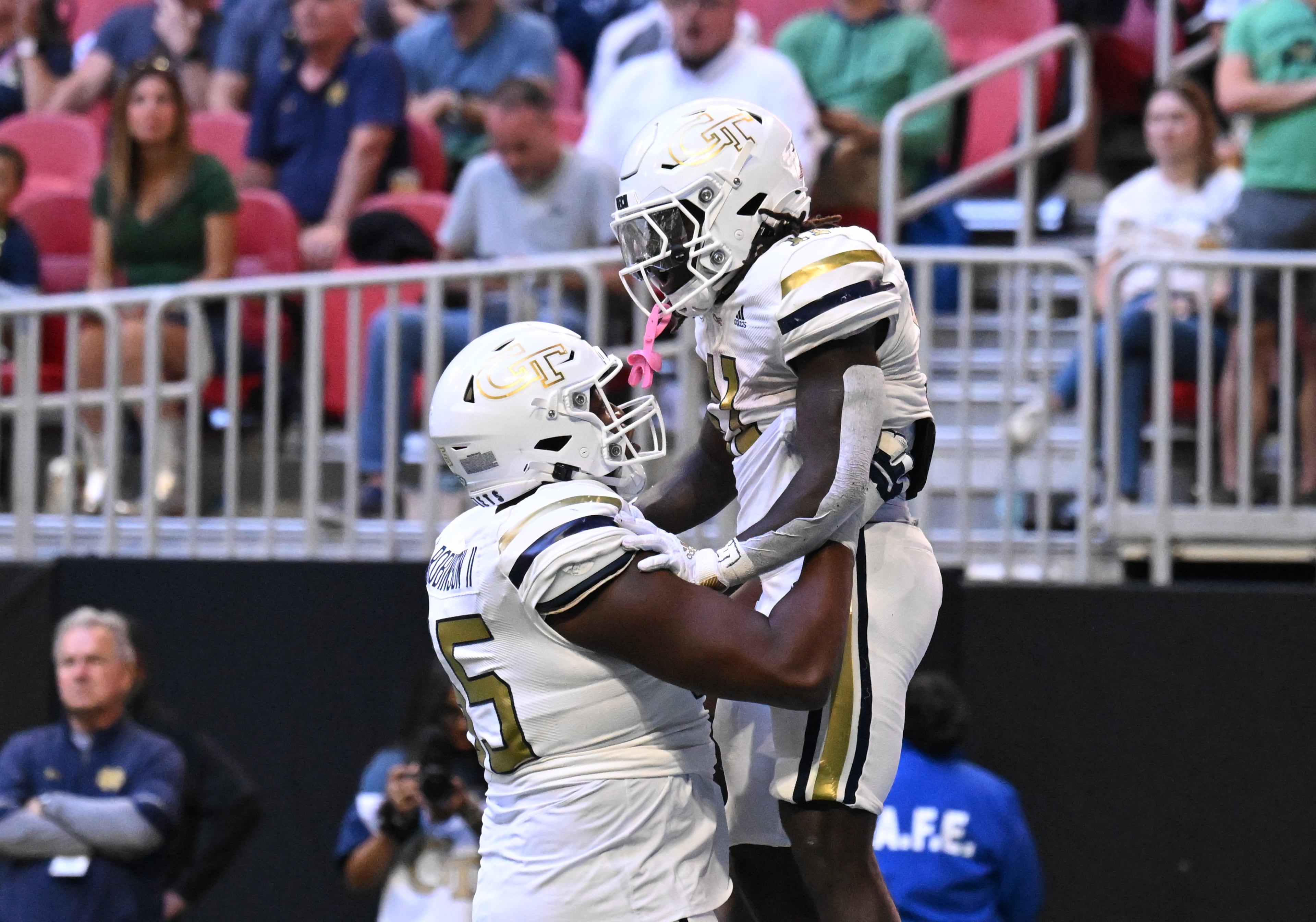 Georgia Tech running back Jamal Haynes (11) celebrates by a teammate after scoring a touchdown run during the first half in an NCAA football game at Mercedes-Benz Stadium, Saturday, October 19, 2024, in Atlanta. (Hyosub Shin / AJC)