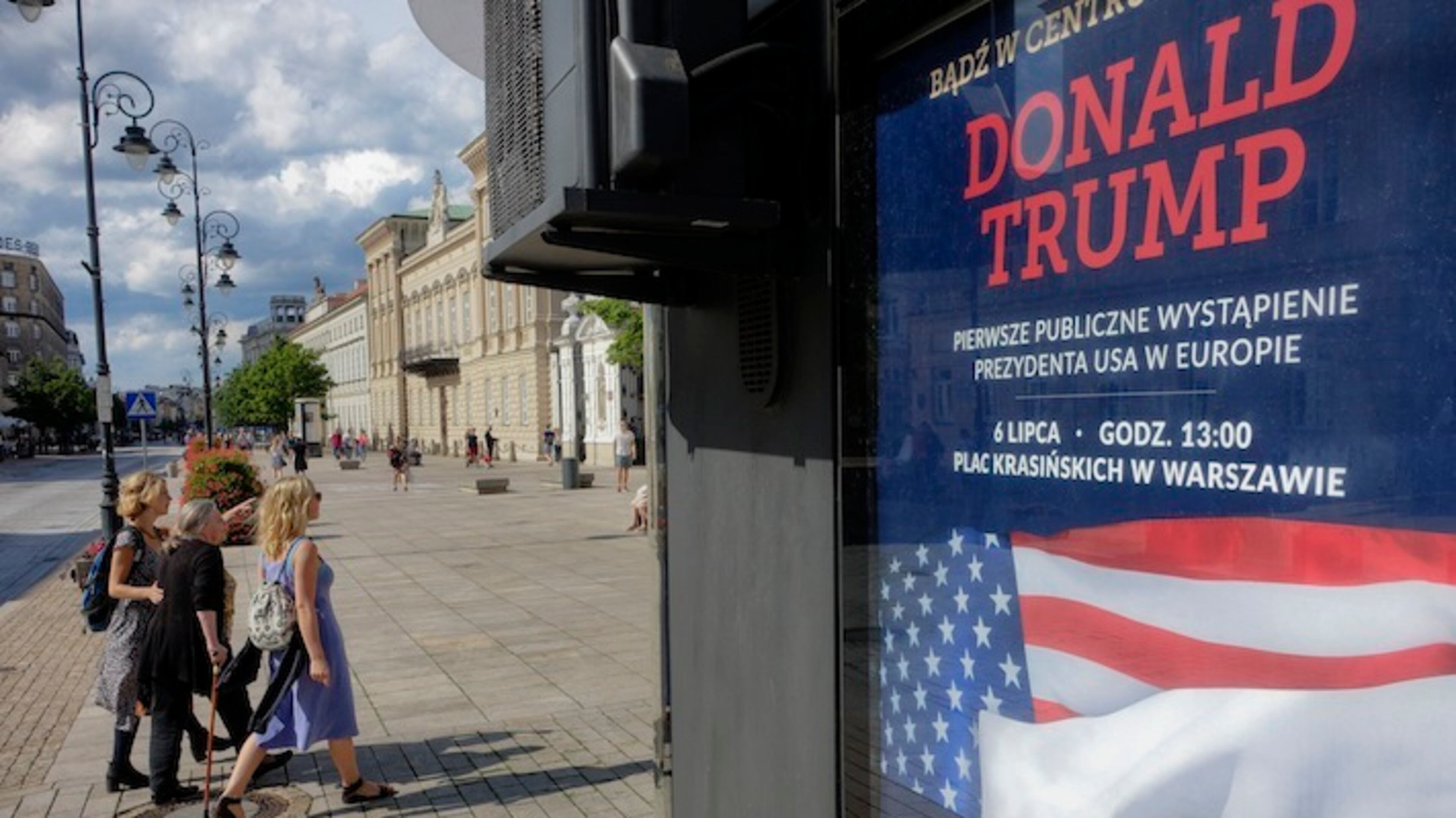 In this photo taken on Saturday, July 1, 2017, Women walk by a poster advertising U.S. President Donald Trump's speech, that reads "Donald Trump. First Public Appearance in Europe", in Warsaw, Poland. U.S. President Donald Trump has broken with tradition in deciding to visit, Poland, an ex-communist country in Central Europe, before Britain, France or Germany on Thursday, July 6, 2017. (AP Photo/Alik Keplicz)