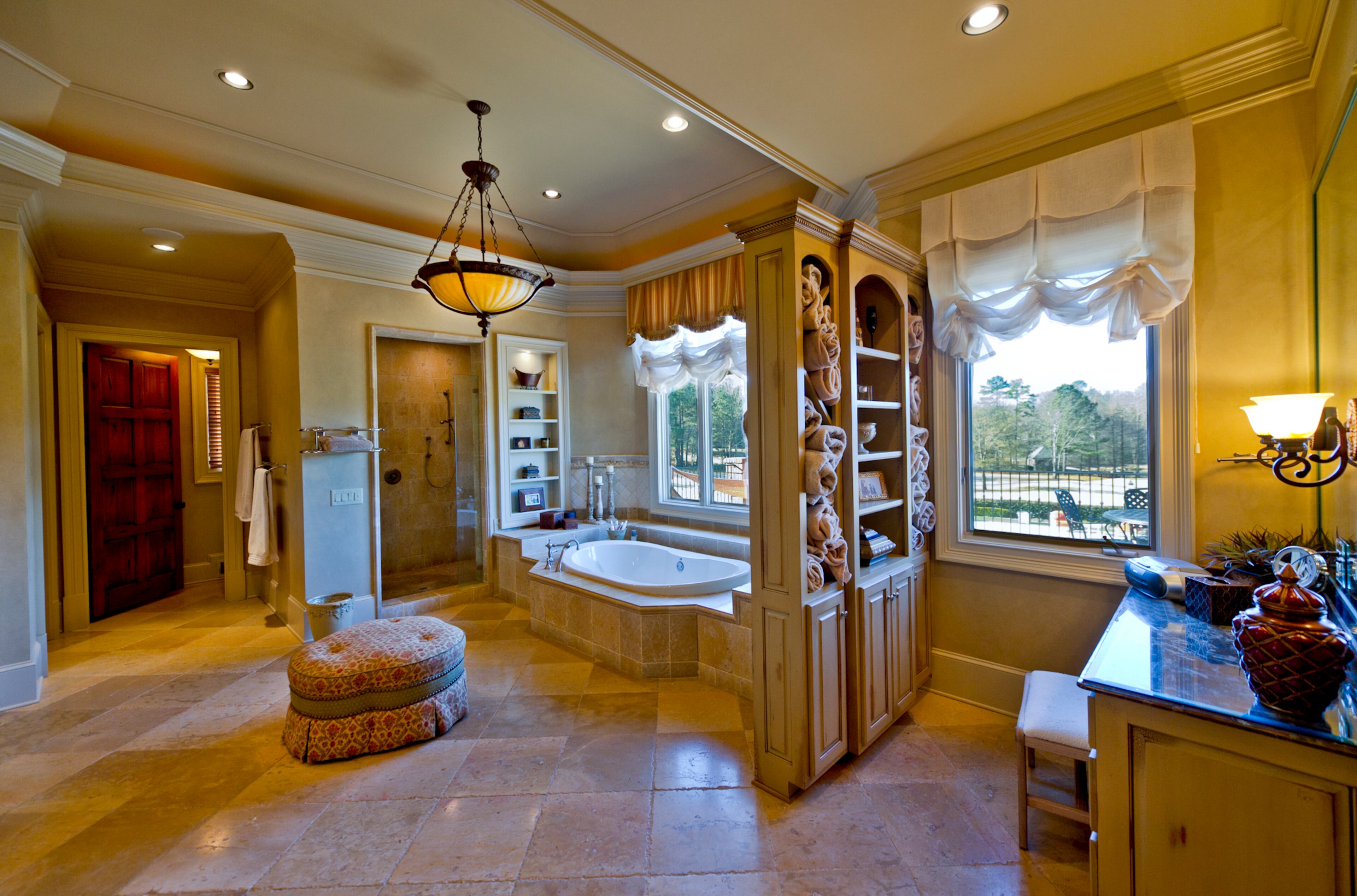 Former Atlanta Braves pitcher John Smoltz is selling his $7.2 million estate, located on 19.7 acres in the gated Greystone community in Milton. According to the listing by Harry Norman Realtors, the 18,000-square-foot home includes 10 bedrooms, 10 bathrooms, an au pair suite, a studio apartment and an eight-car garage. The property also features a custom-designed 18-hole golf course, tennis and basketball courts, a pool and spa, baseball and football fields, a fishing pond and a jogging trail.