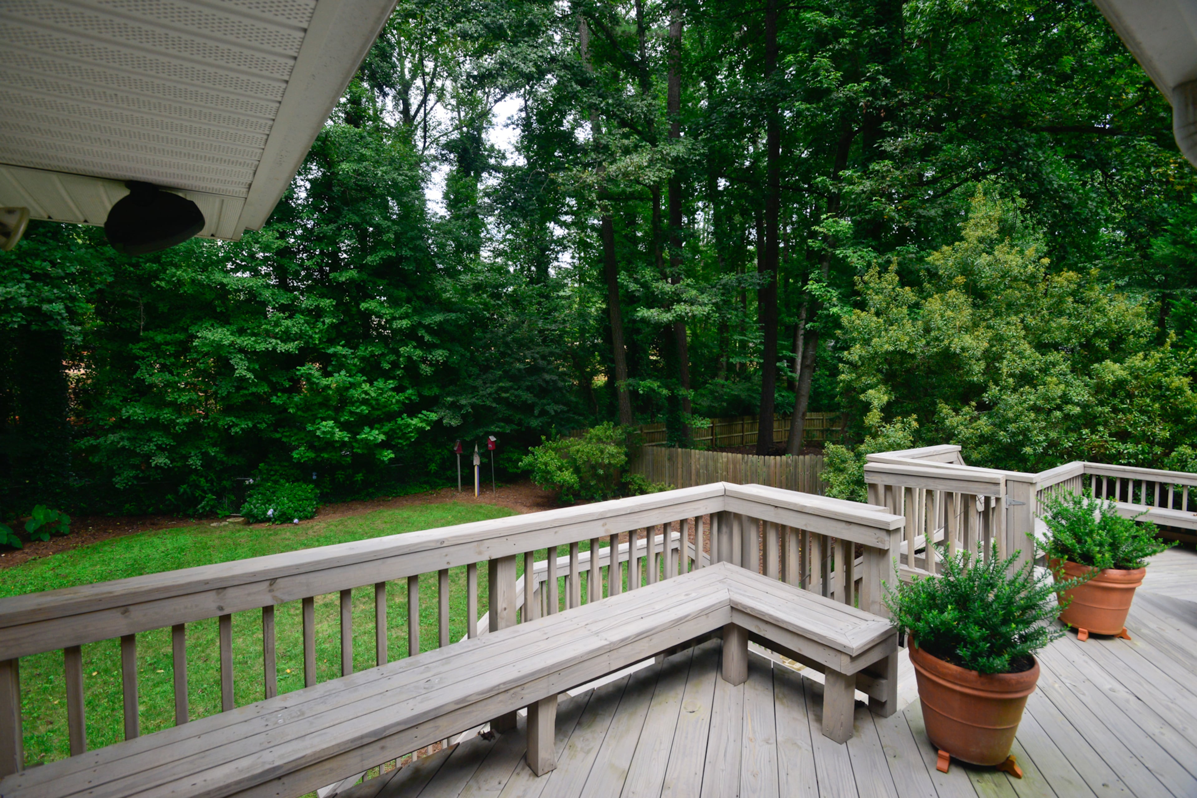 A gray washed stain added a weathered look to the deck, which has a gas grill and an island.