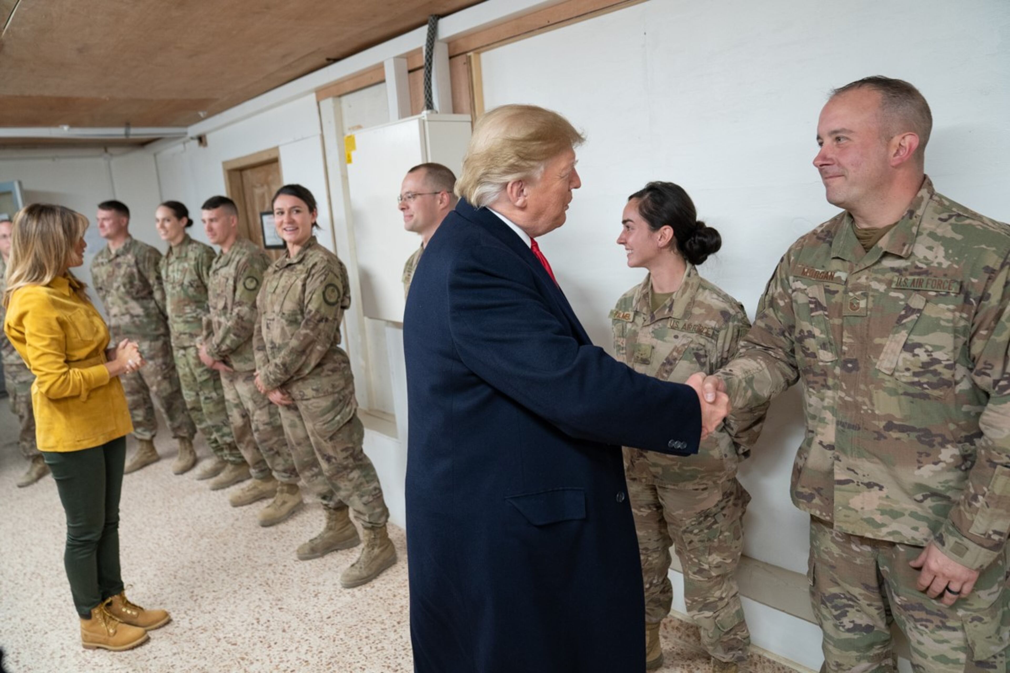 President Donald J. Trump, joined by First Lady Melania Trump, shakes hands and speaks with U.S. troops Wednesday, December 26, 2018, prior to a demonstration of military equipment at the Al-Asad Airbase in Iraq.