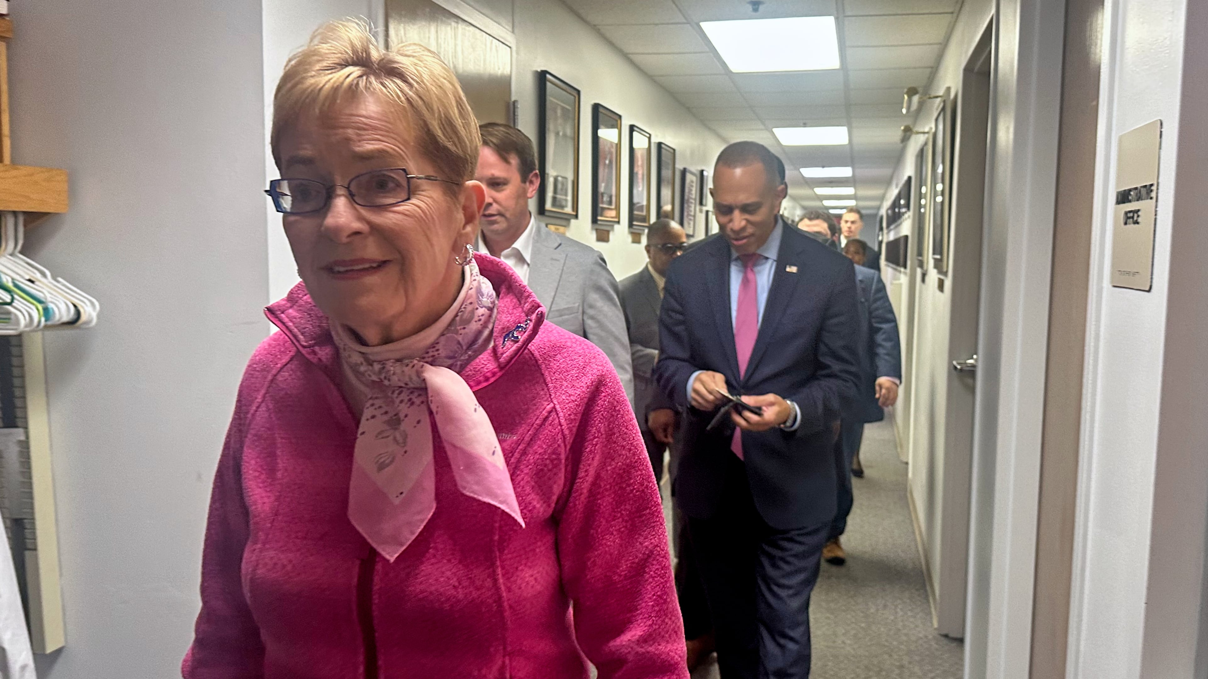 In this photo taken with a smart phone, Rep. Marcy Kaptur, left, and House Democratic Leader Hakeem Jeffries walk before a church services as they campaign for the midterm elections, Sunday, Oct. 18, 2026, in battleground Toledo, Ohio. (AP Photo/Lisa Mascaro)