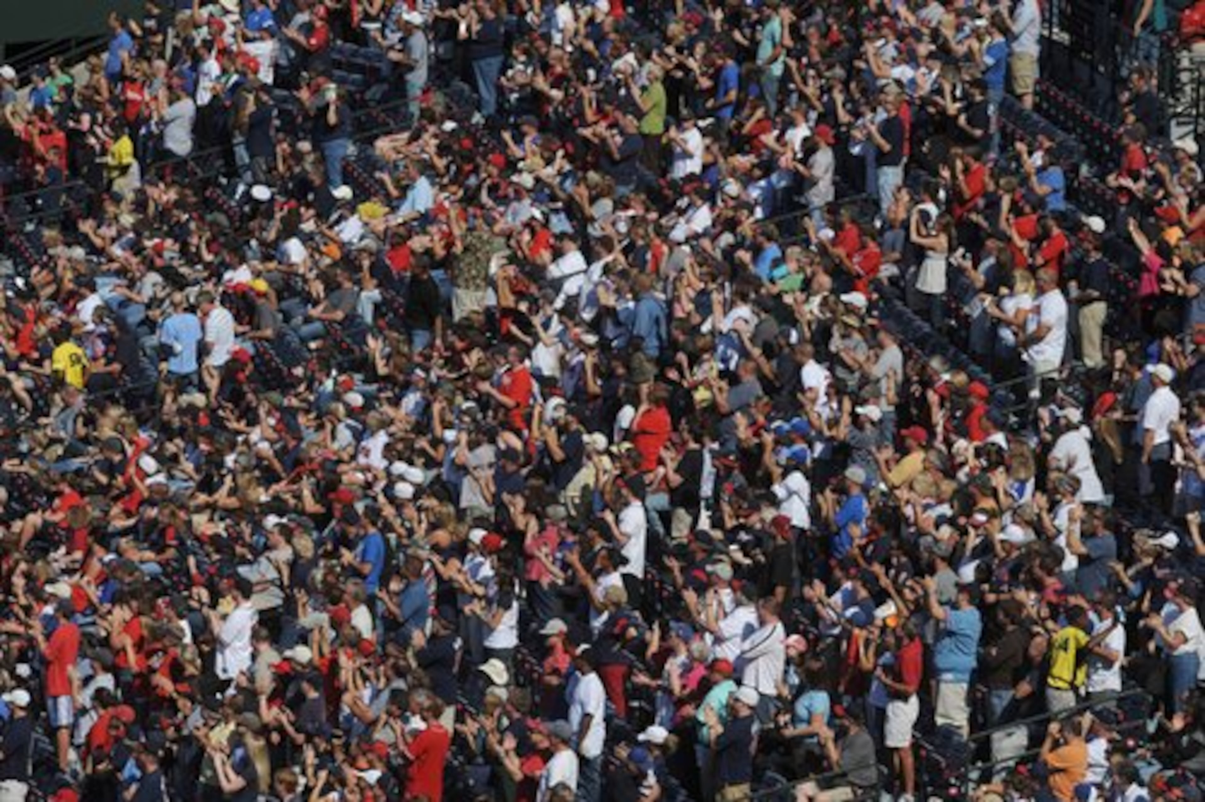 Sellout crowd gives Bobby Cox a standing ovation as he heads toward the stage during pre-game ceremony.