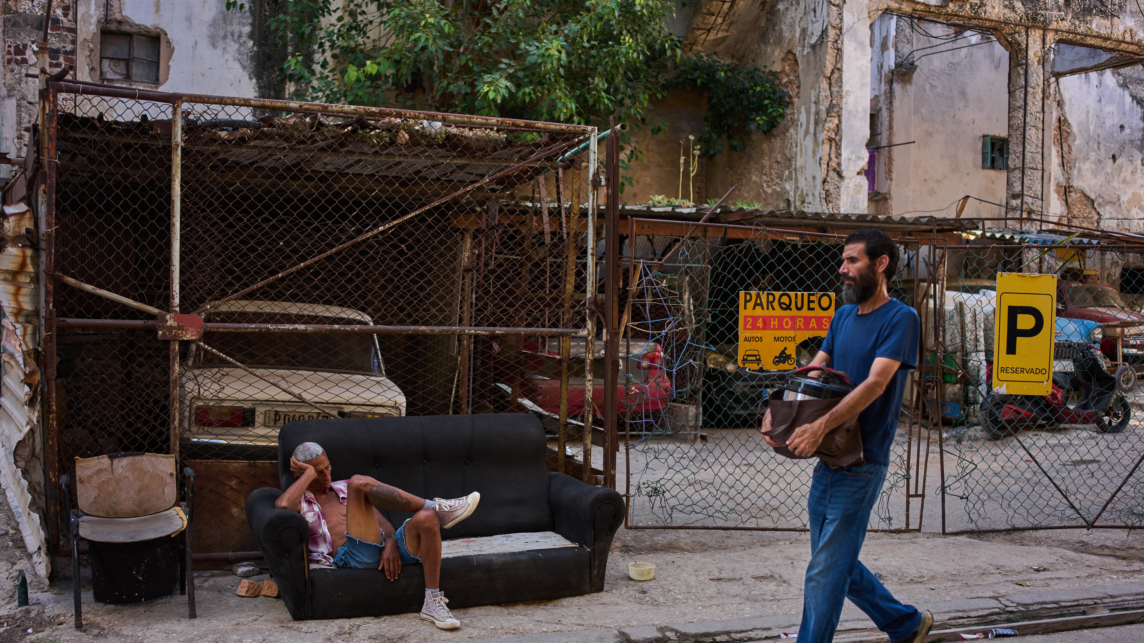 A man rests on a sofa on a street in Havana, Cuba, Thursday, Aug. 27, 2026. (AP Photo/Ramon Espinosa)