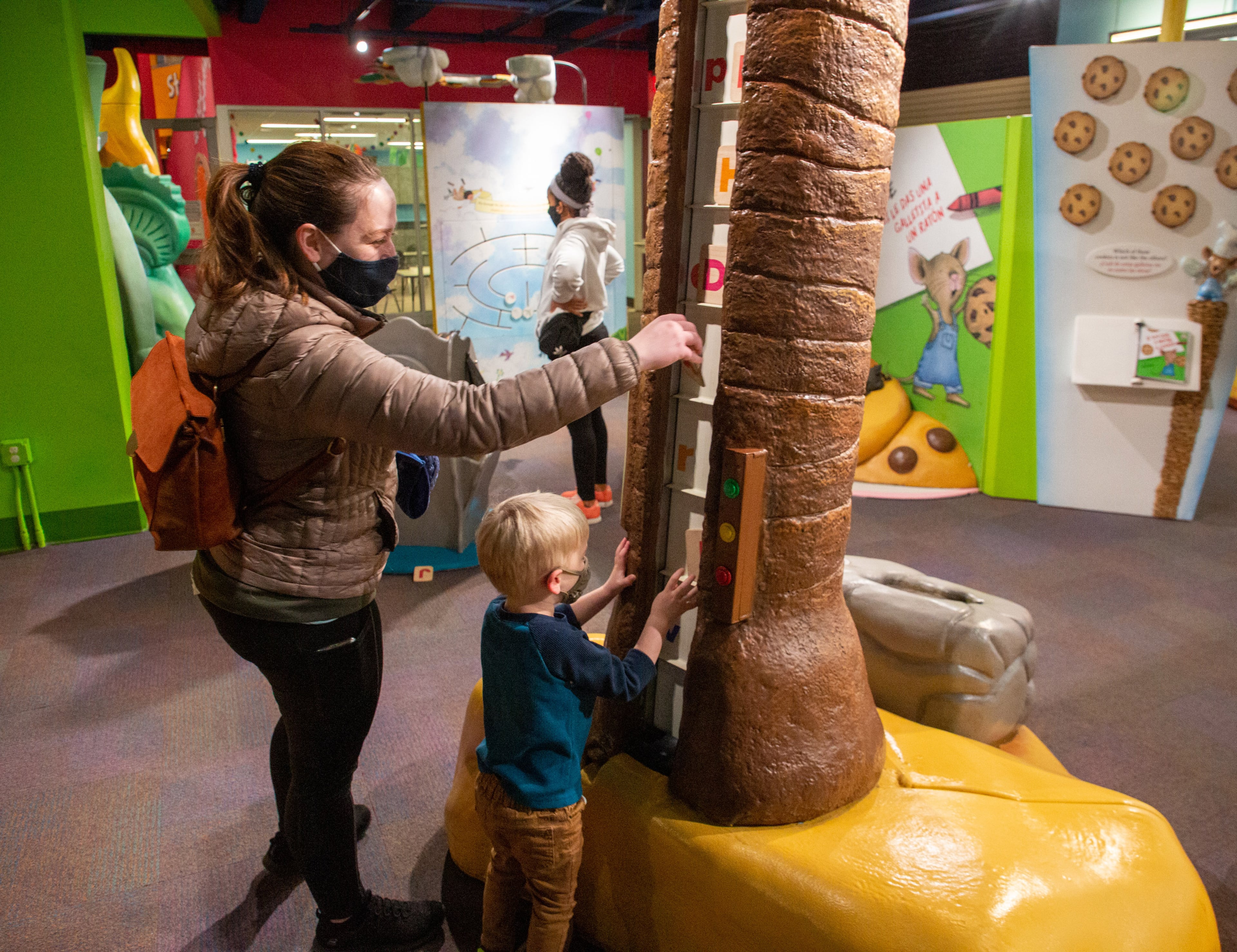 Julie Andrews and her son Lincoln, 3, enjoy interactive fun at one of the book exhibits at the Children's Museum of Atlanta on Saturday, February 5, 2022. "Storyland: A Trip Through Childhood Favorites" continues through May 30. (Photo: Steve Schaefer for The Atlanta Journal-Constitution)