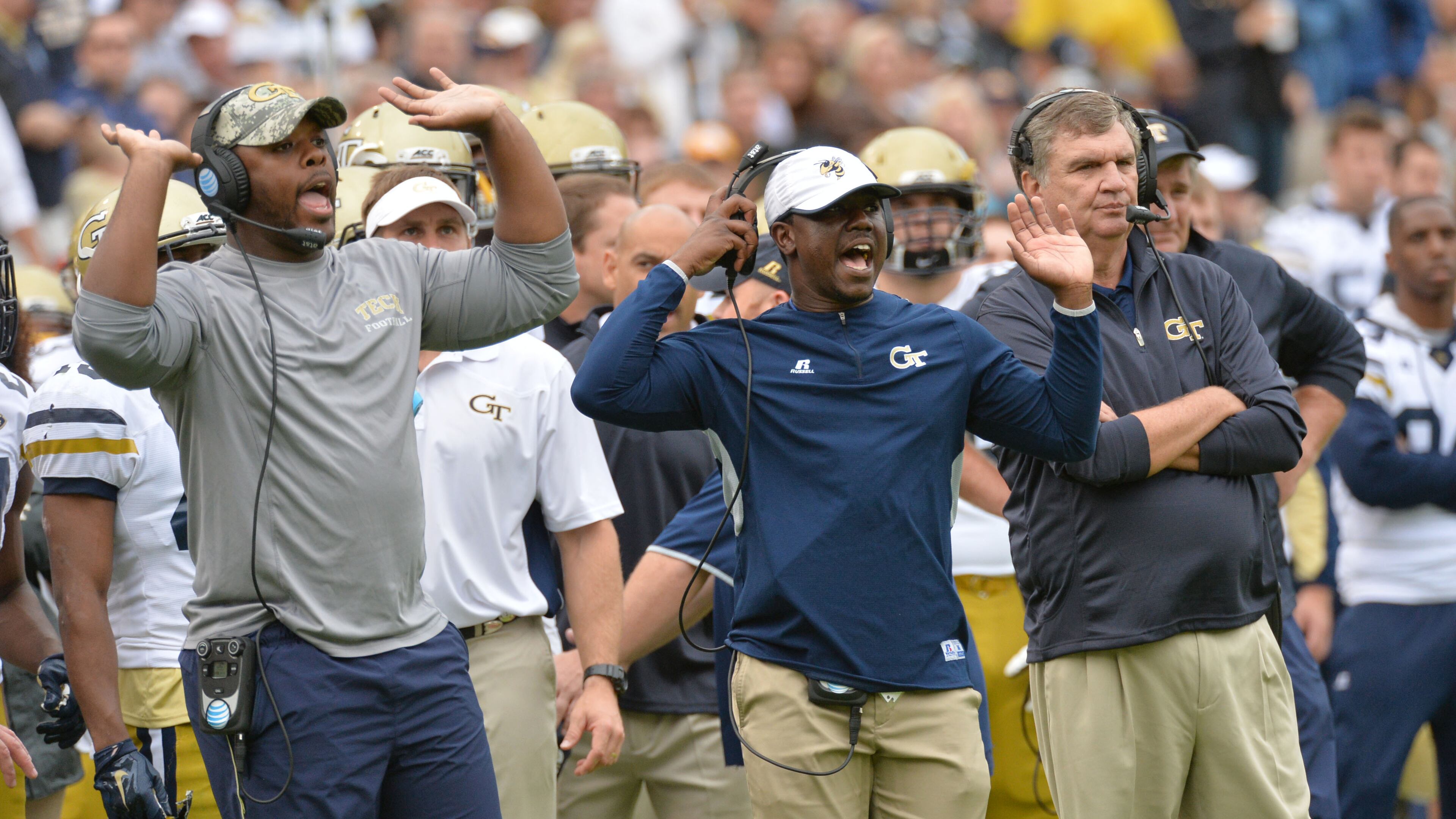 October 3, 2015 Atlanta - Georgia Tech Yellow Jackets Graduate Assistant coach Steven Sylvester (left) and A-Backs coach Lamar Owens (right) send signals from the sideline in the first half against the North Carolina Tar Heels at Bobby Dodd Stadium on Saturday, October 3, 2015. HYOSUB SHIN / HSHIN@AJC.COM
