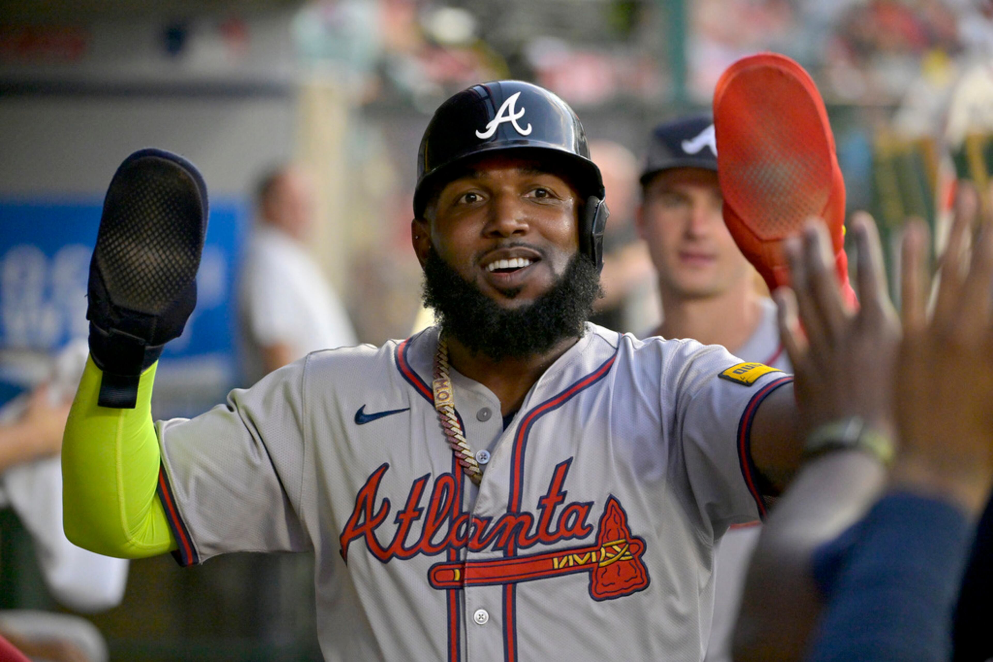 Atlanta Braves' Marcell Ozuna is congratulated in the dugout after scoring in the fourth inning of a baseball game against the Los Angeles Angels, Friday, Aug. 16, 2024, in Anaheim, Calif. (AP Photo/Jayne Kamin-Oncea)