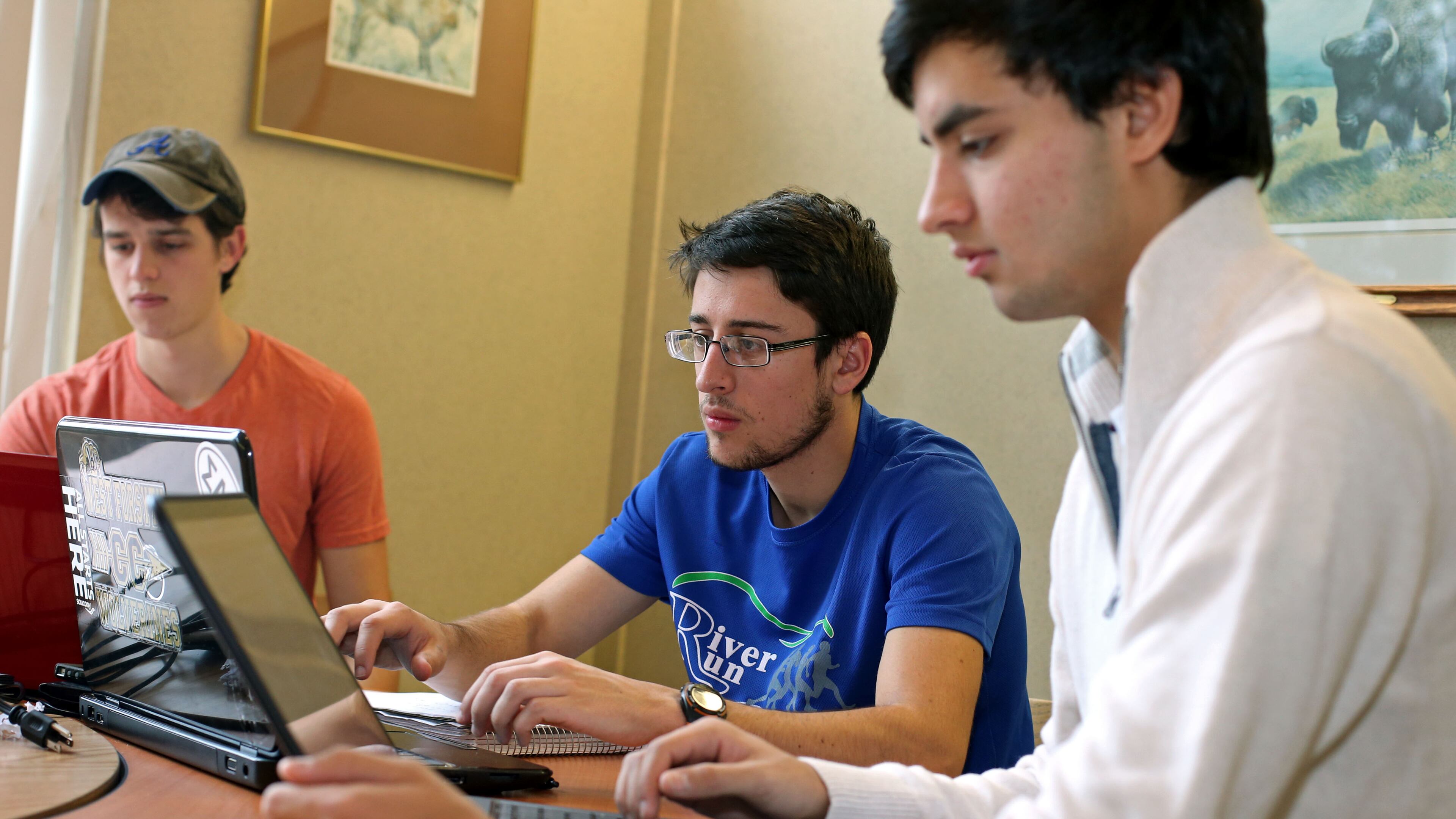 Southern Polytechnic State University freshman Doug Baldwin, of Cumming, left, Sam Shackleford, also of Cumming, center, and Liel Vanderhoeven, of Roswell, study for their finals on campus Thursday morning in Marietta, Ga., December 5, 2013. Photo by Jason Getz / AJC