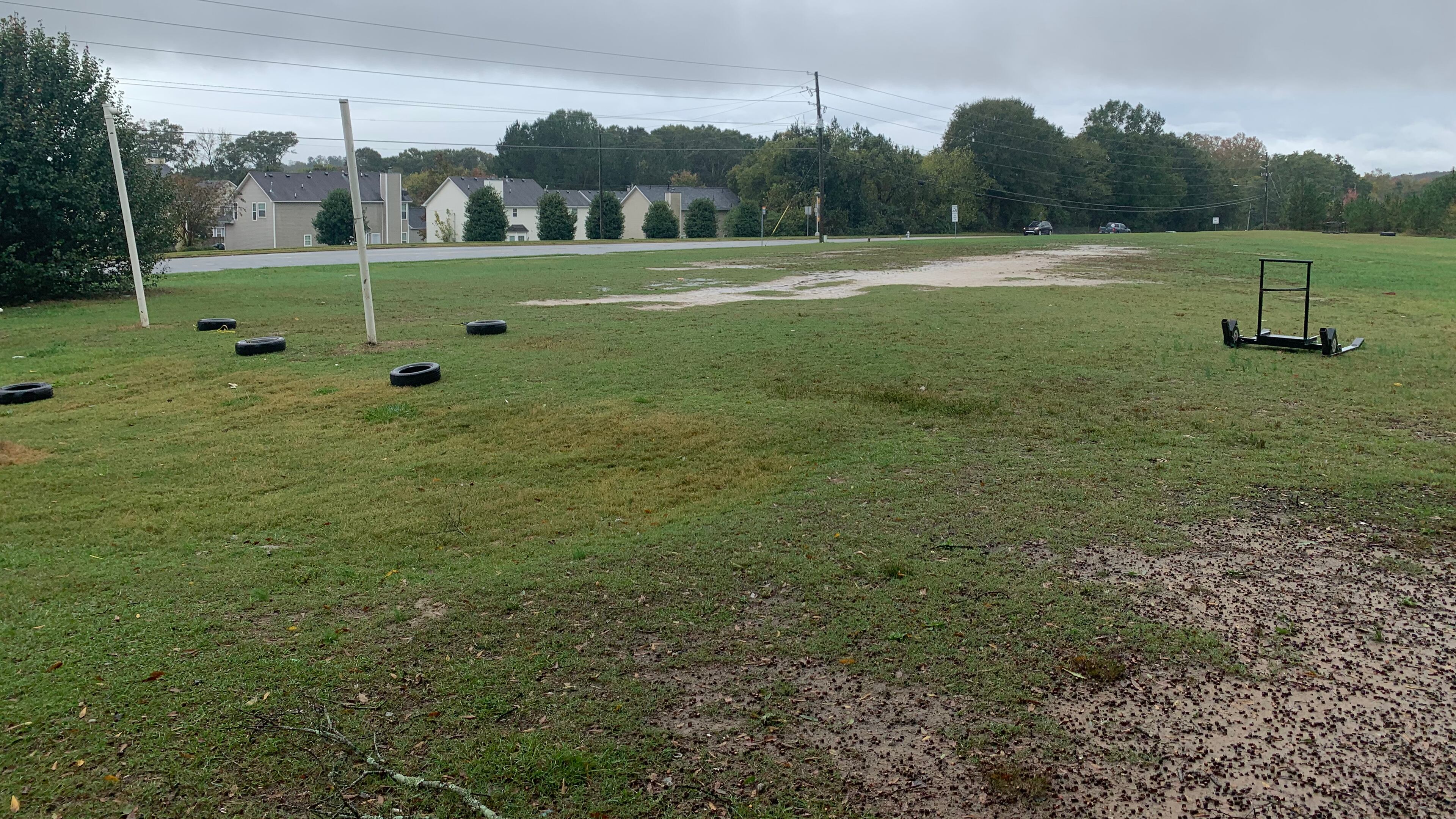 Hapeville Charter's practice field is less than 100 yards long and 50 yards wide, is uneven, has dirt patches and divots and is cutoff by a sidewalk that separates the field and Buffington Road. (Courtesy of Hapeville Charter)