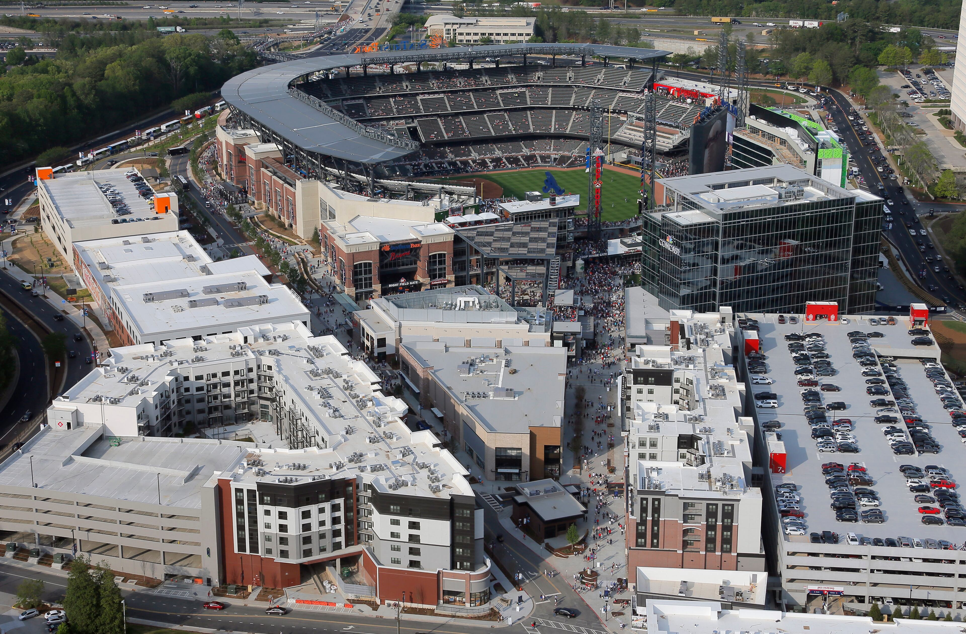 Fans enter SunTrust Park about an hour before game time. This view is looking to the east, showing The Battery.