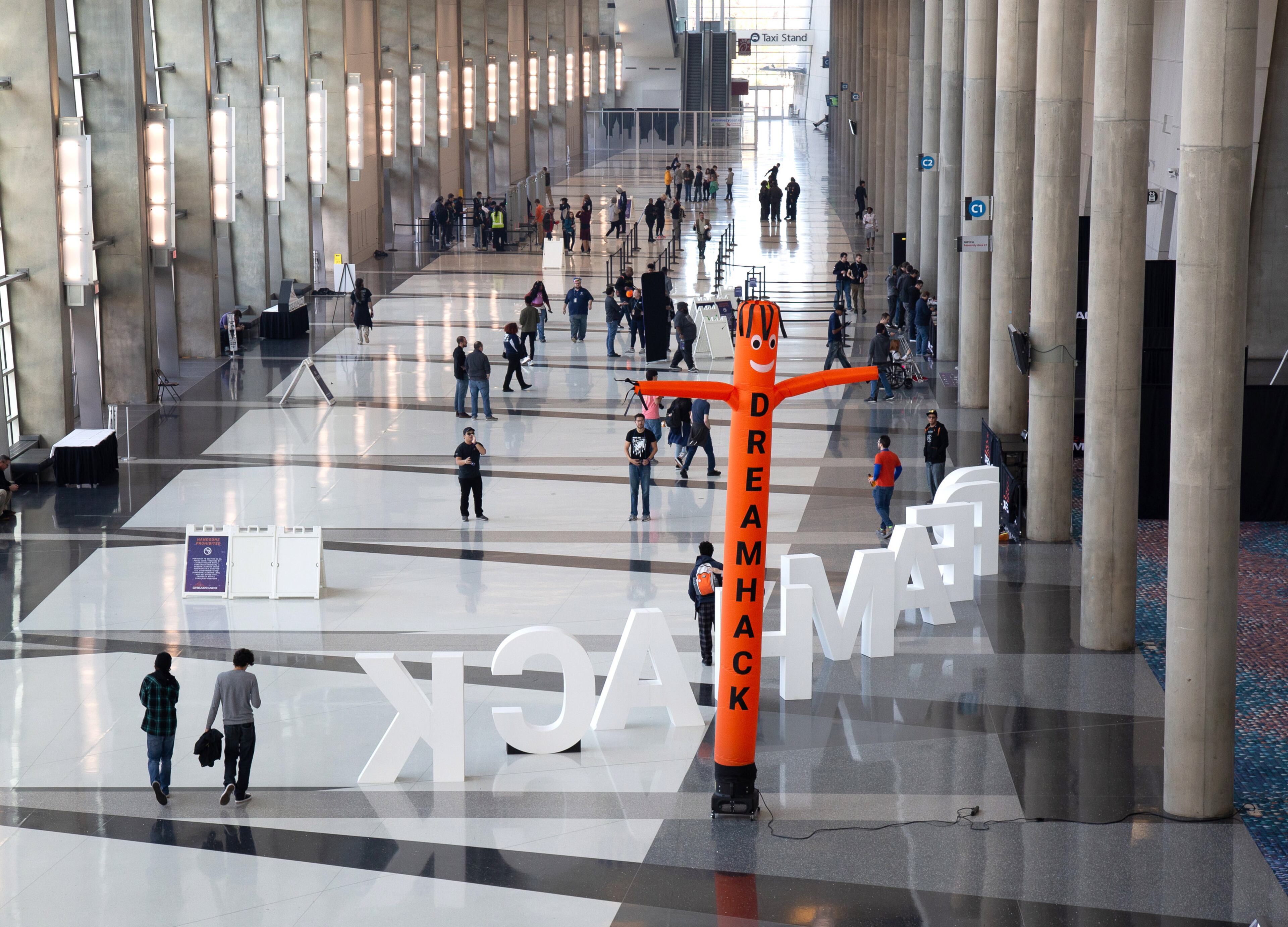 People walk into the Georgia World Congress Center Sunday for the DreamHack Atlanta convention on November 17, 2019. STEVE SCHAEFER / SPECIAL TO THE AJC